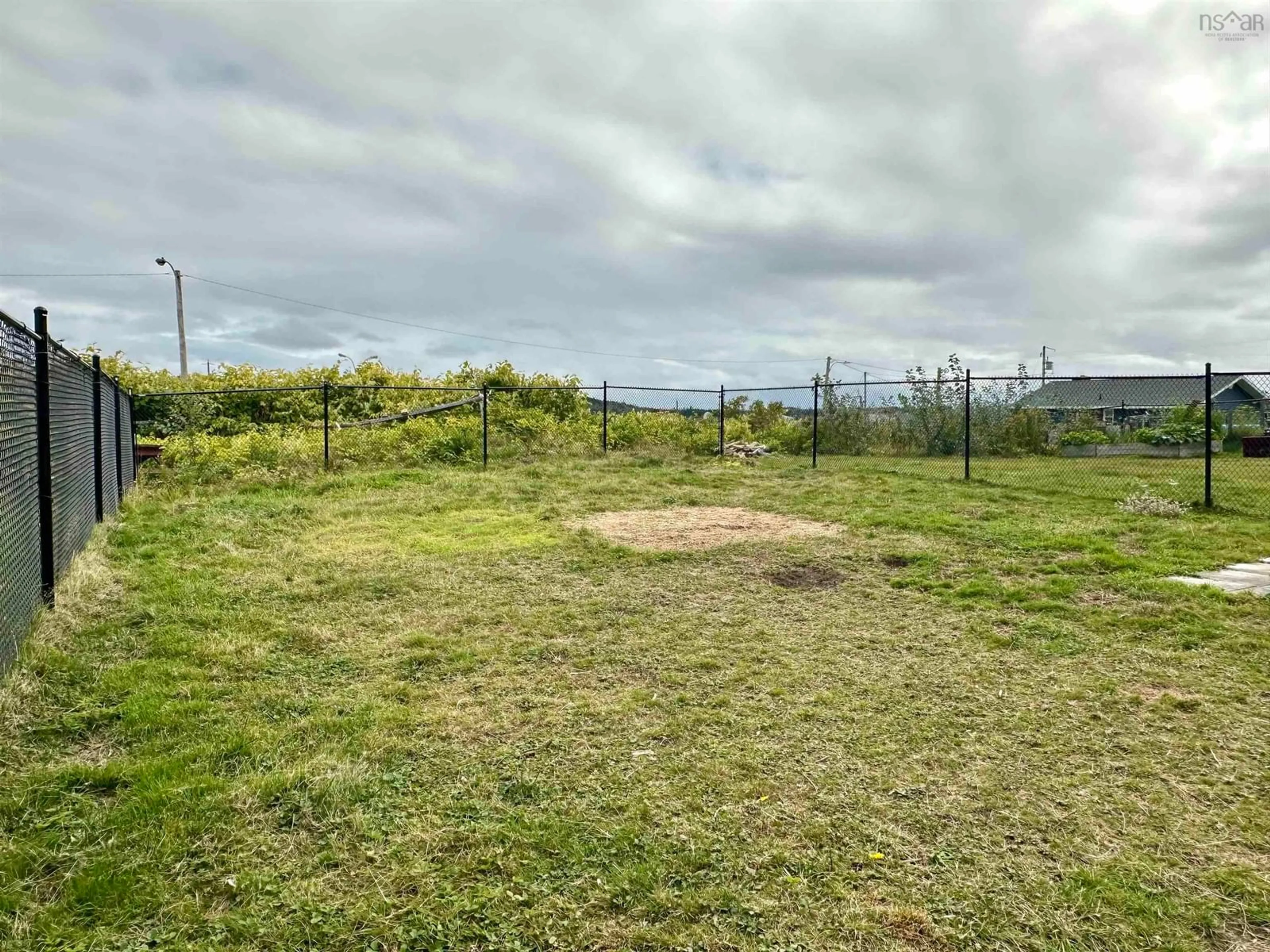 A pic from outside/outdoor area/front of a property/back of a property/a pic from drone, forest/trees view for 24 Upper Warren St, Louisbourg Nova Scotia B1C 1M8