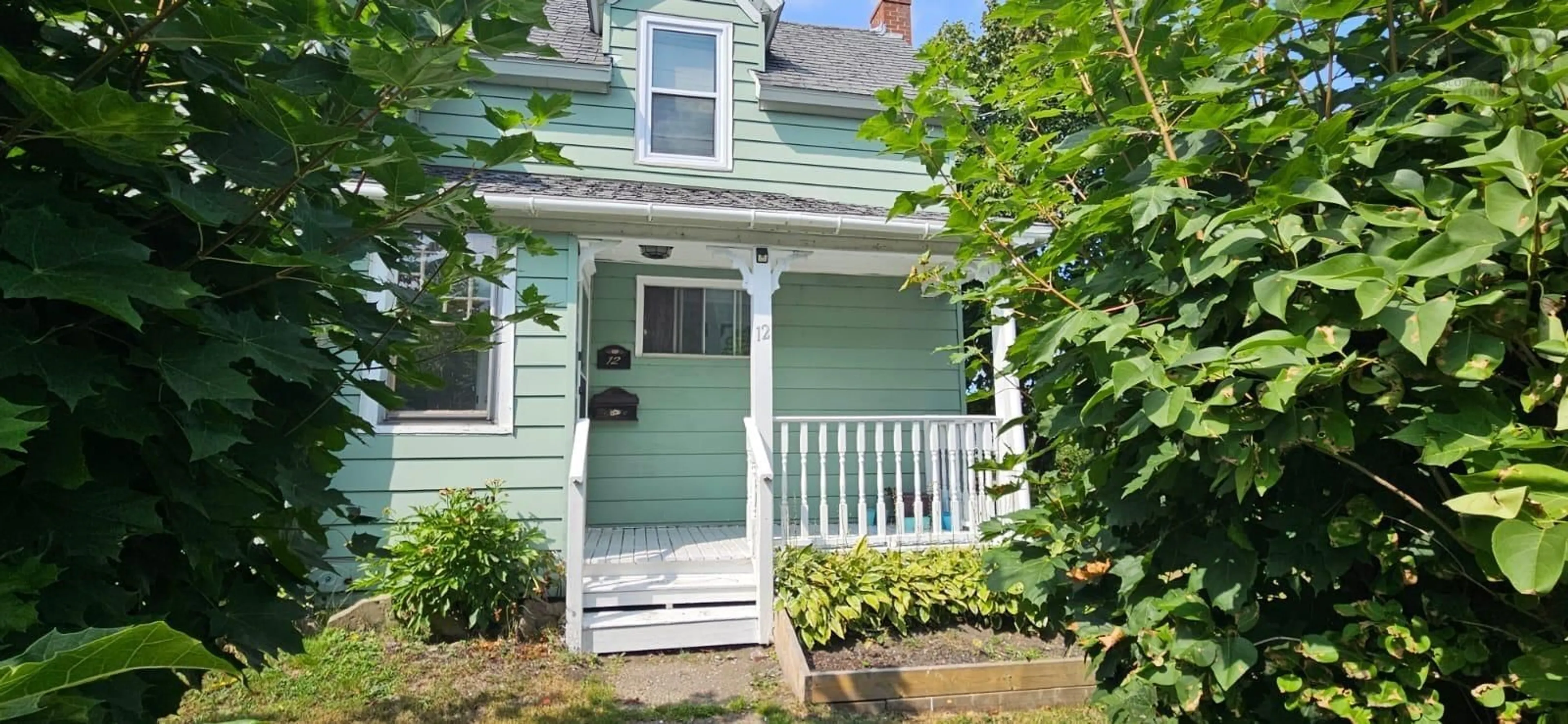 Home with vinyl exterior material, street for 12 Queen Street, Sydney Mines Nova Scotia B1V 1K6