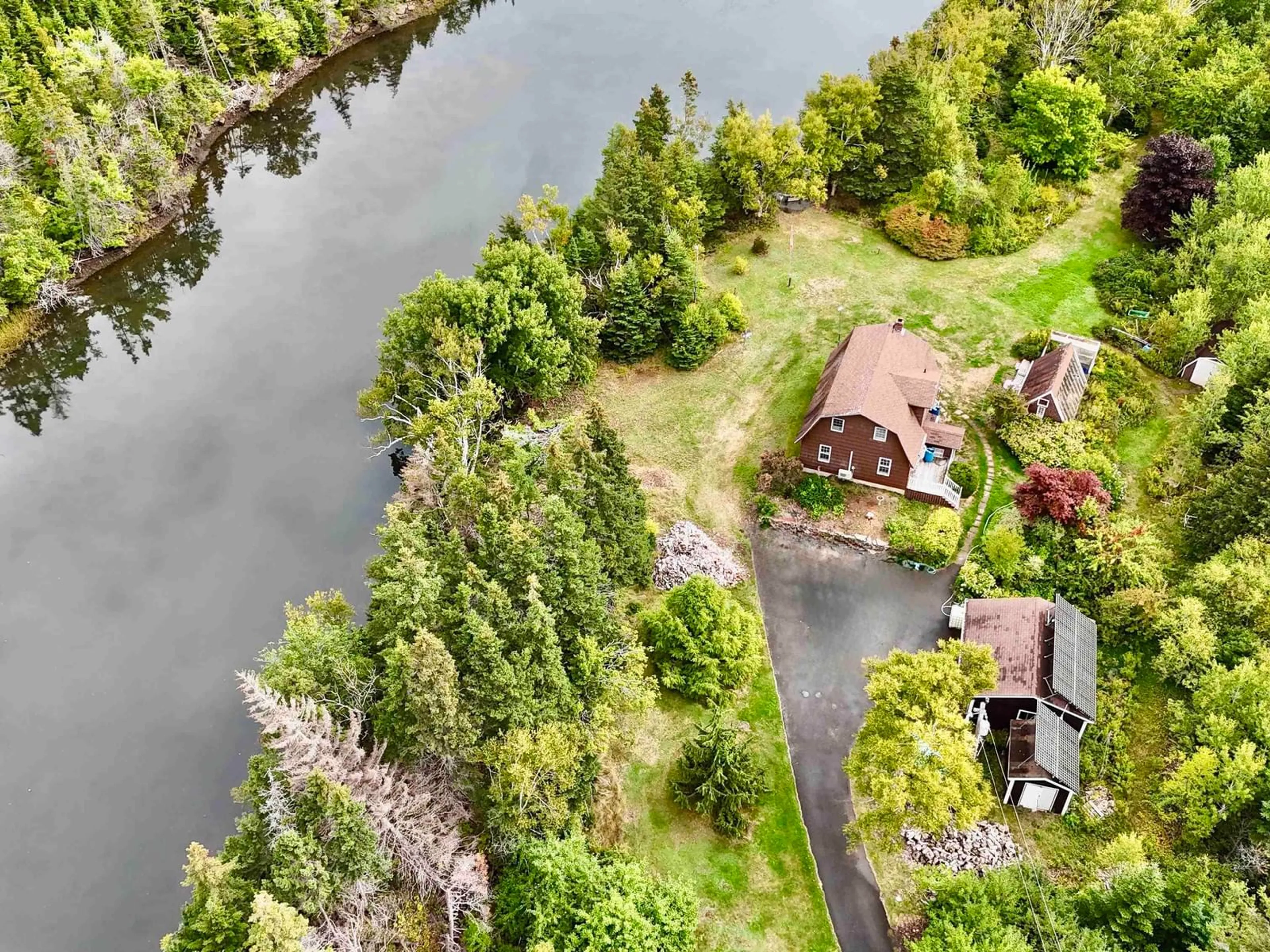A pic from outside/outdoor area/front of a property/back of a property/a pic from drone, water/lake/river/ocean view for 3535 Highway 255, Black Brook Nova Scotia B1B 1T7