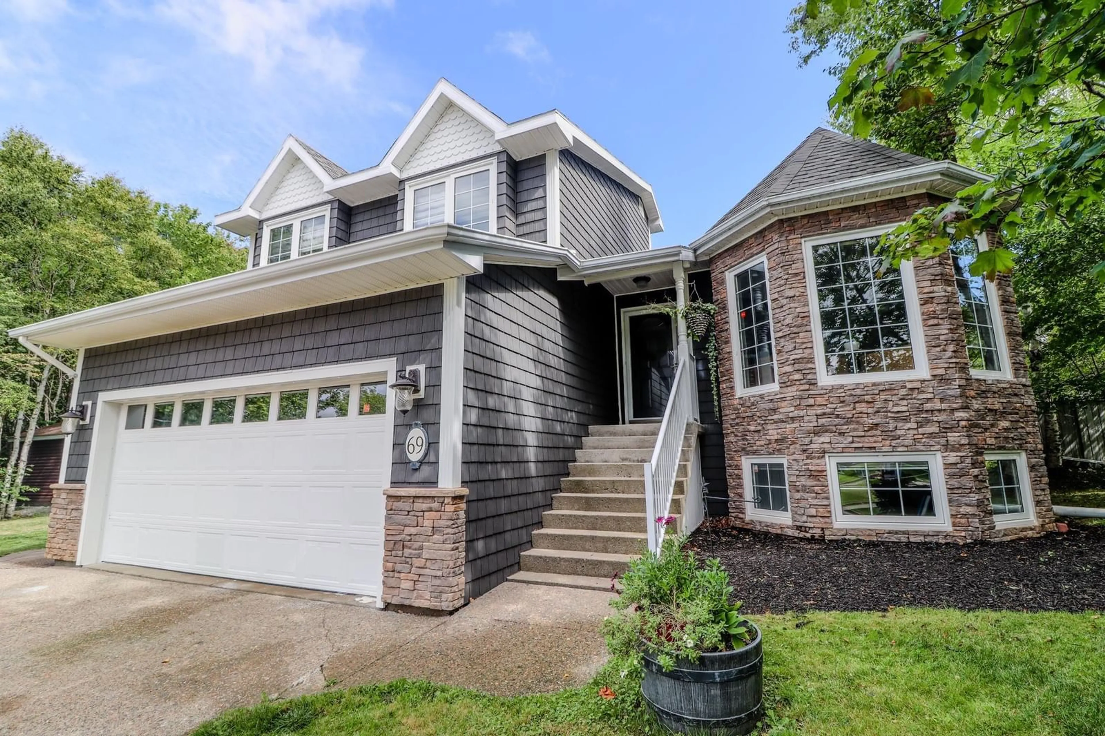 Home with vinyl exterior material, street for 69 Silverwood Dr, Sydney Nova Scotia B1S 2Z9