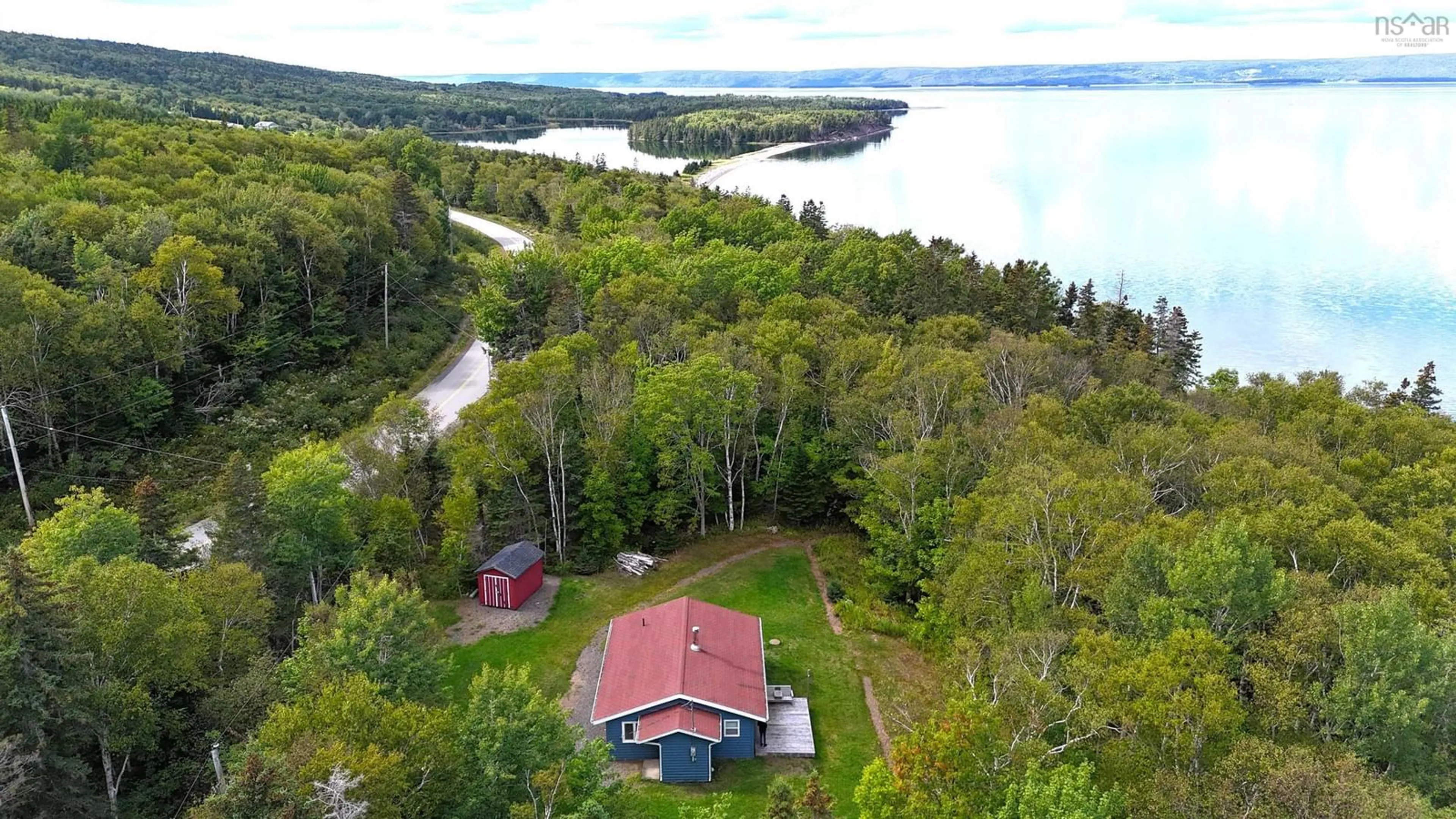 A pic from outside/outdoor area/front of a property/back of a property/a pic from drone, water/lake/river/ocean view for 5735 West Bay Rd, Roberta Nova Scotia B0E 3K0