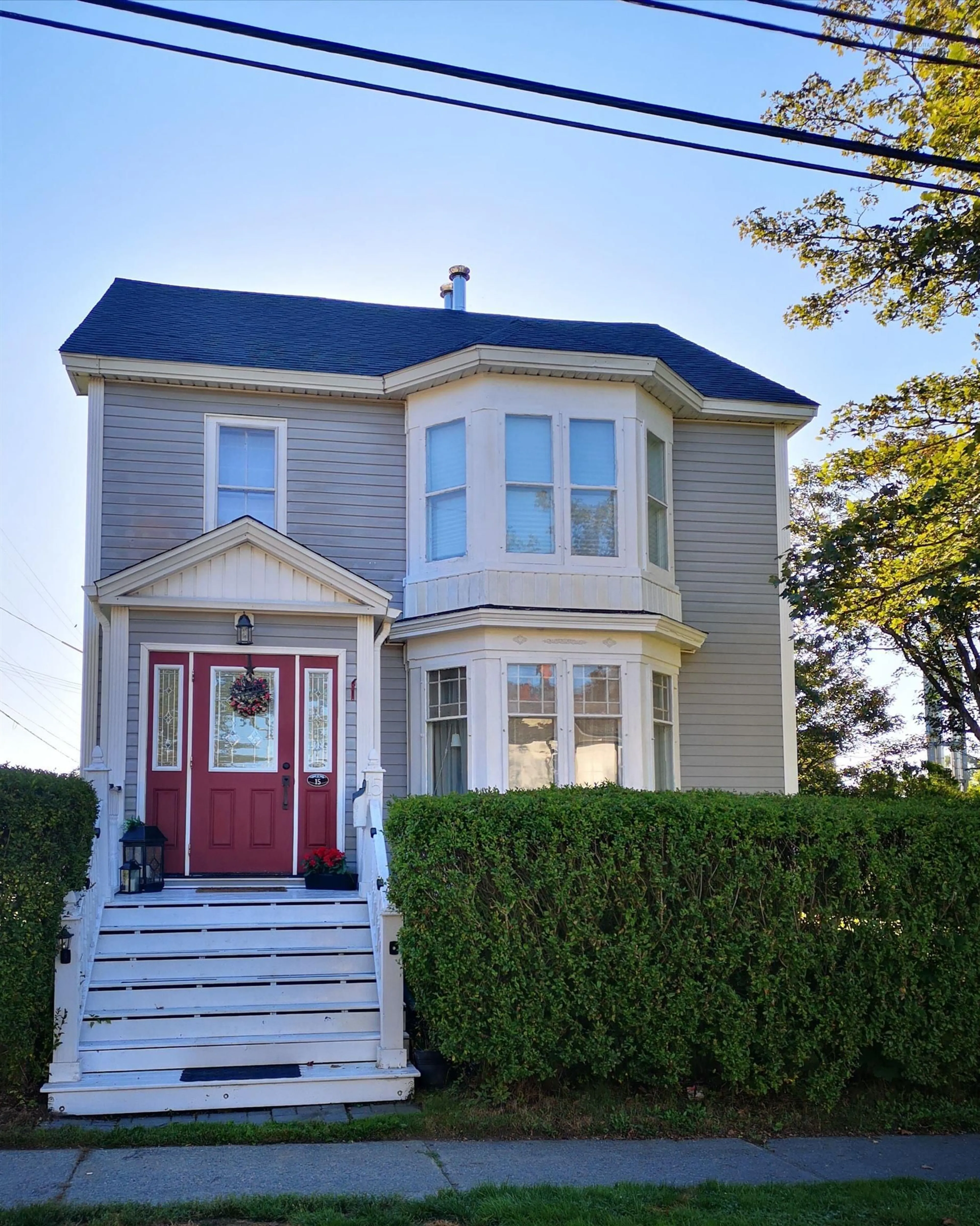 Home with vinyl exterior material, street for 15 Brunswick St, Yarmouth Nova Scotia B5A 2E2