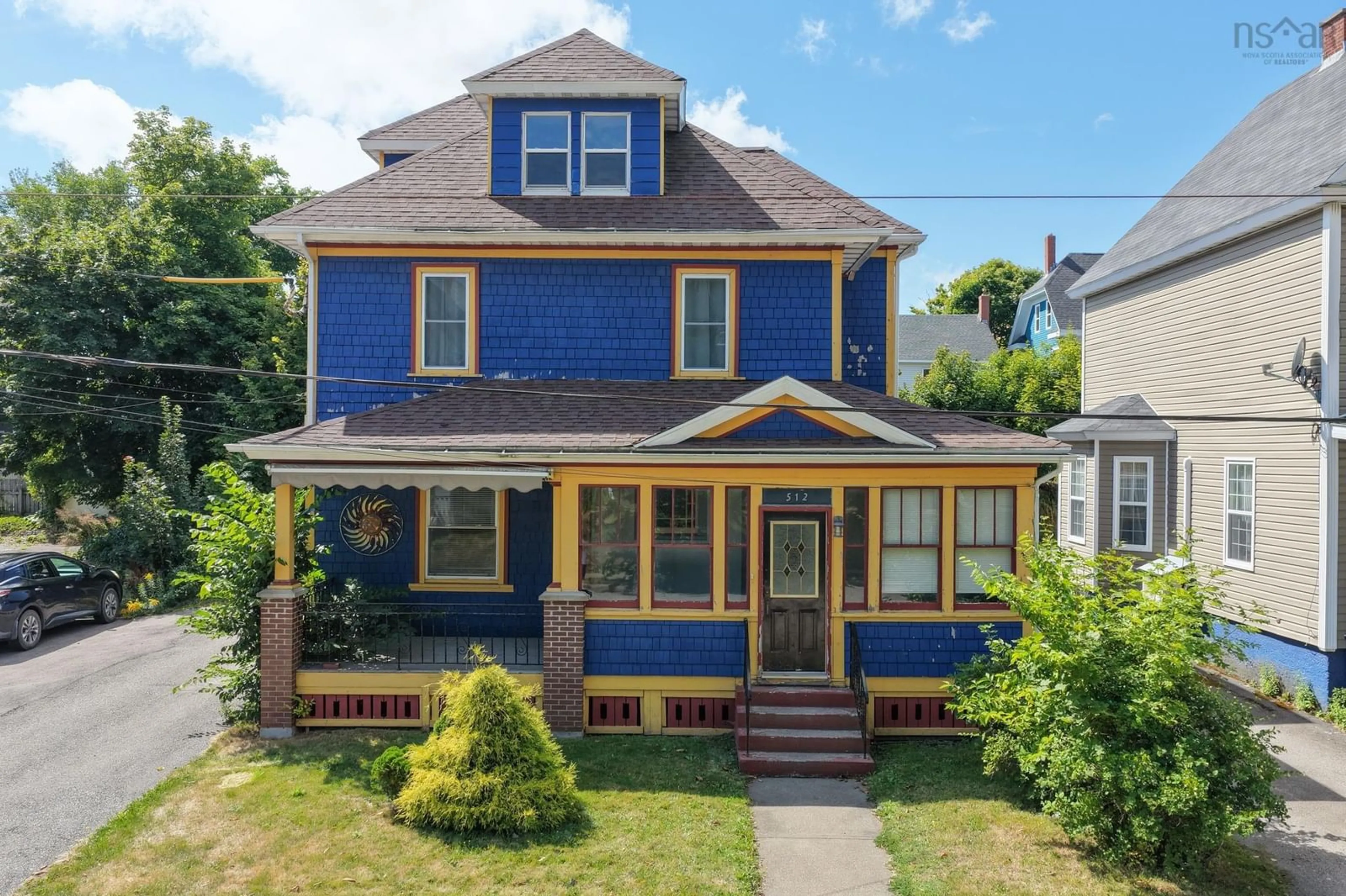 Home with vinyl exterior material, street for 512 Charlotte St, Sydney Nova Scotia B1P 1E7