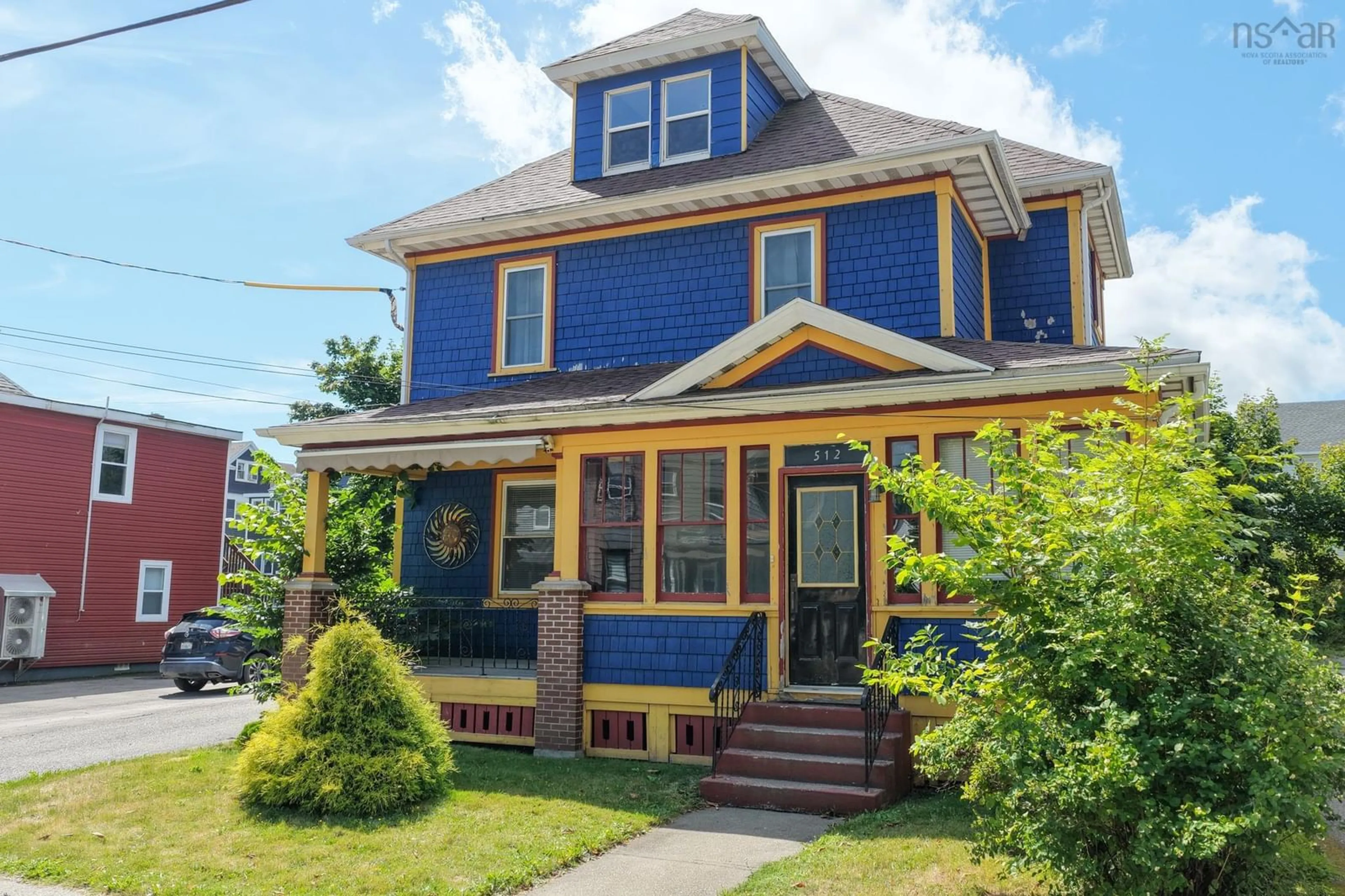 Home with vinyl exterior material, street for 512 Charlotte St, Sydney Nova Scotia B1P 1E7