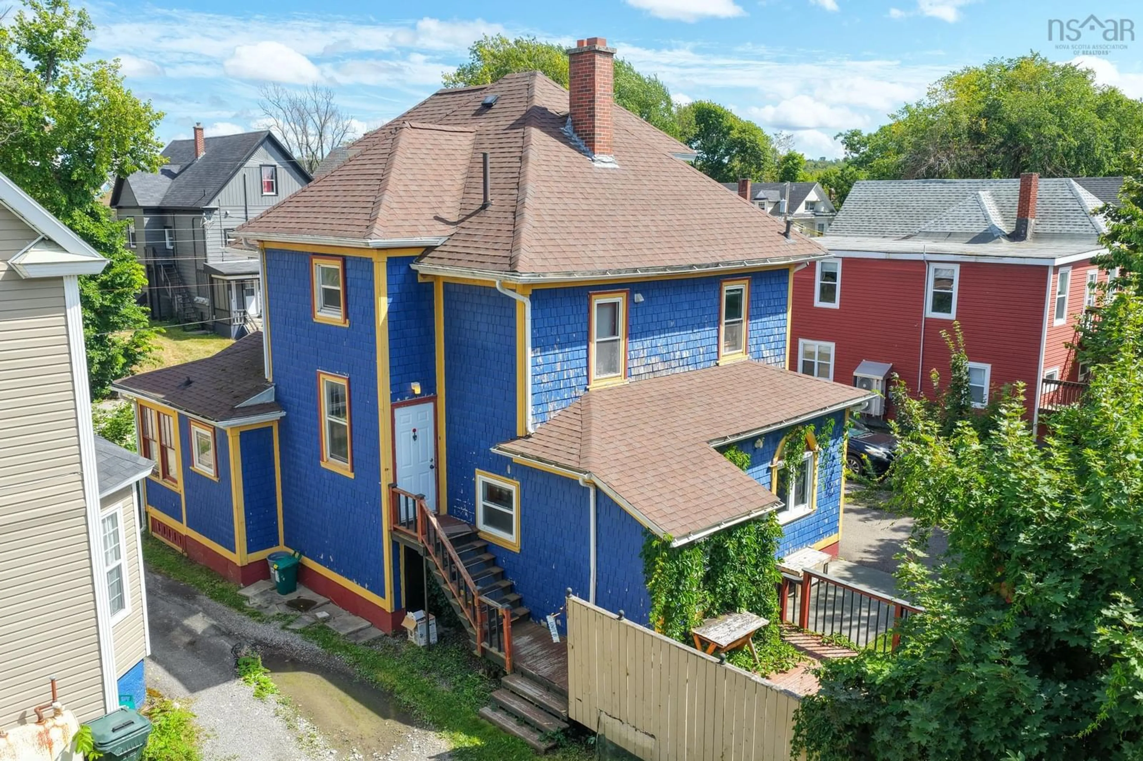 A pic from outside/outdoor area/front of a property/back of a property/a pic from drone, street for 512 Charlotte St, Sydney Nova Scotia B1P 1E7
