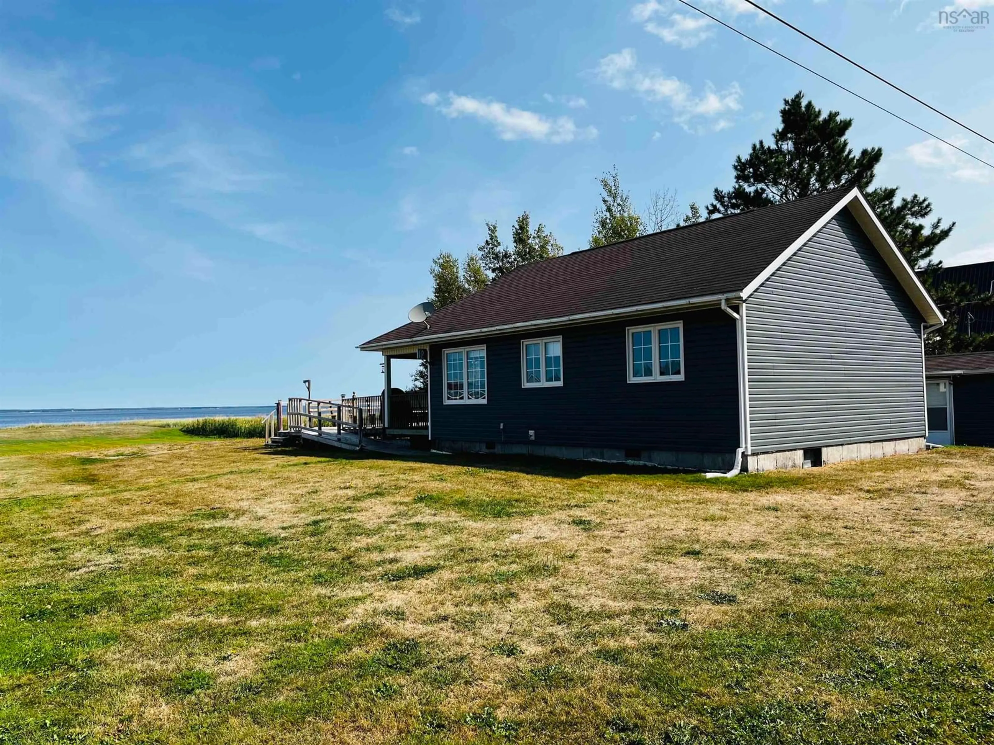 A pic from outside/outdoor area/front of a property/back of a property/a pic from drone, water/lake/river/ocean view for 64 Baxters Beach Lane, Tidnish Cross Roads Nova Scotia B4H 3X9