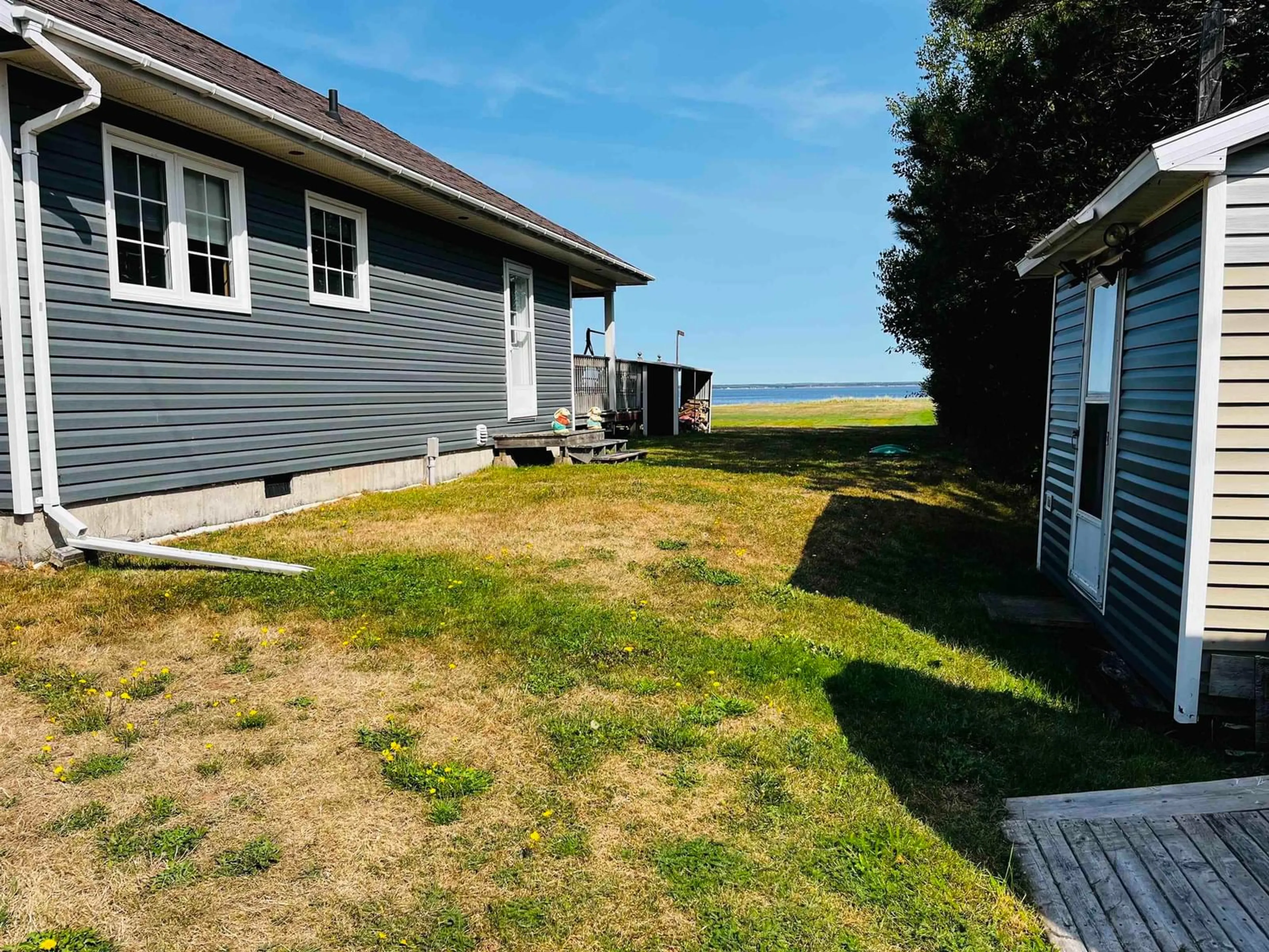 A pic from outside/outdoor area/front of a property/back of a property/a pic from drone, water/lake/river/ocean view for 64 Baxters Beach Lane, Tidnish Cross Roads Nova Scotia B4H 3X9
