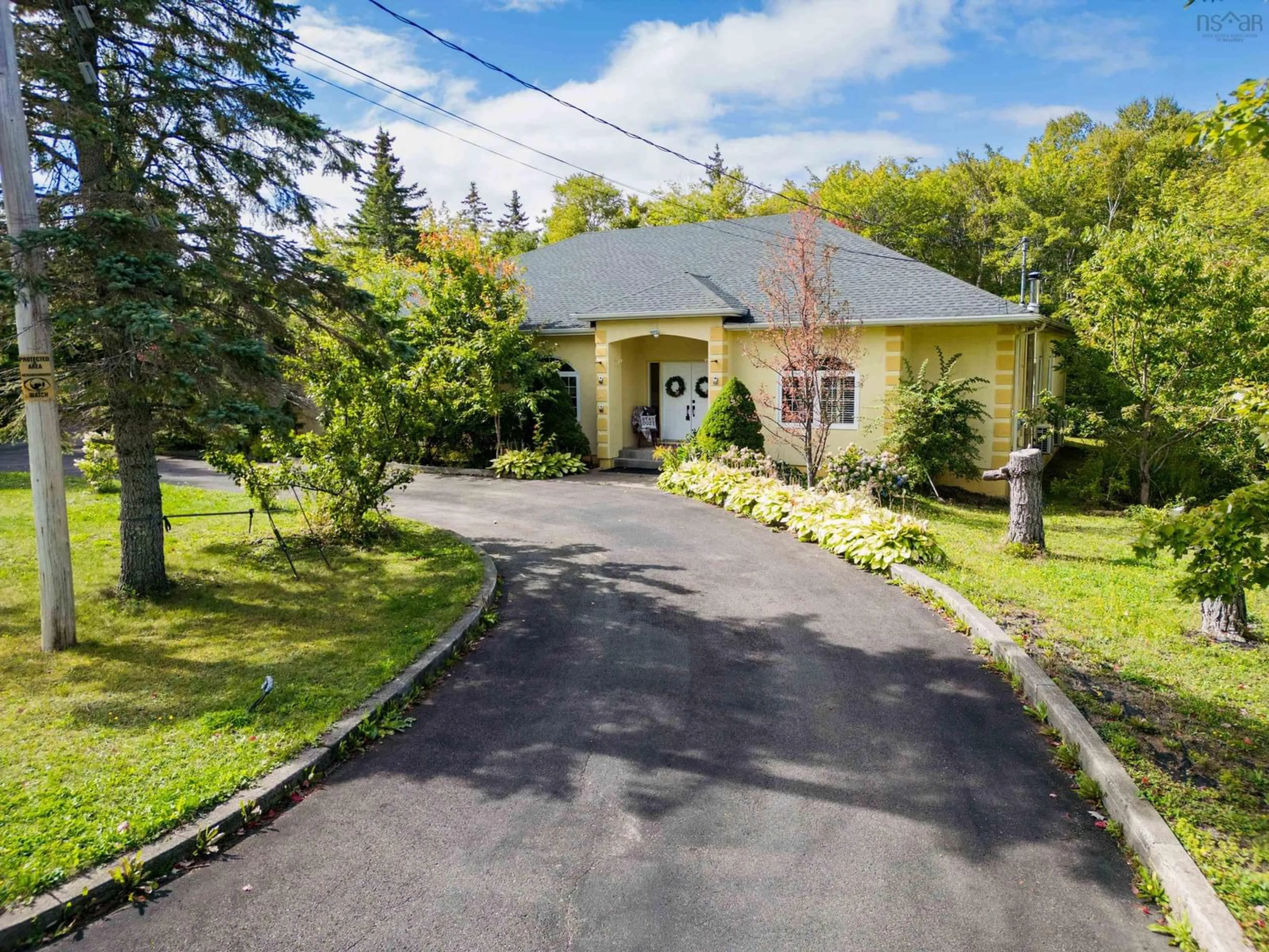 A pic from outside/outdoor area/front of a property/back of a property/a pic from drone, street for 50 Carriage Hill Dr, Sydney River Nova Scotia B1S 3L7
