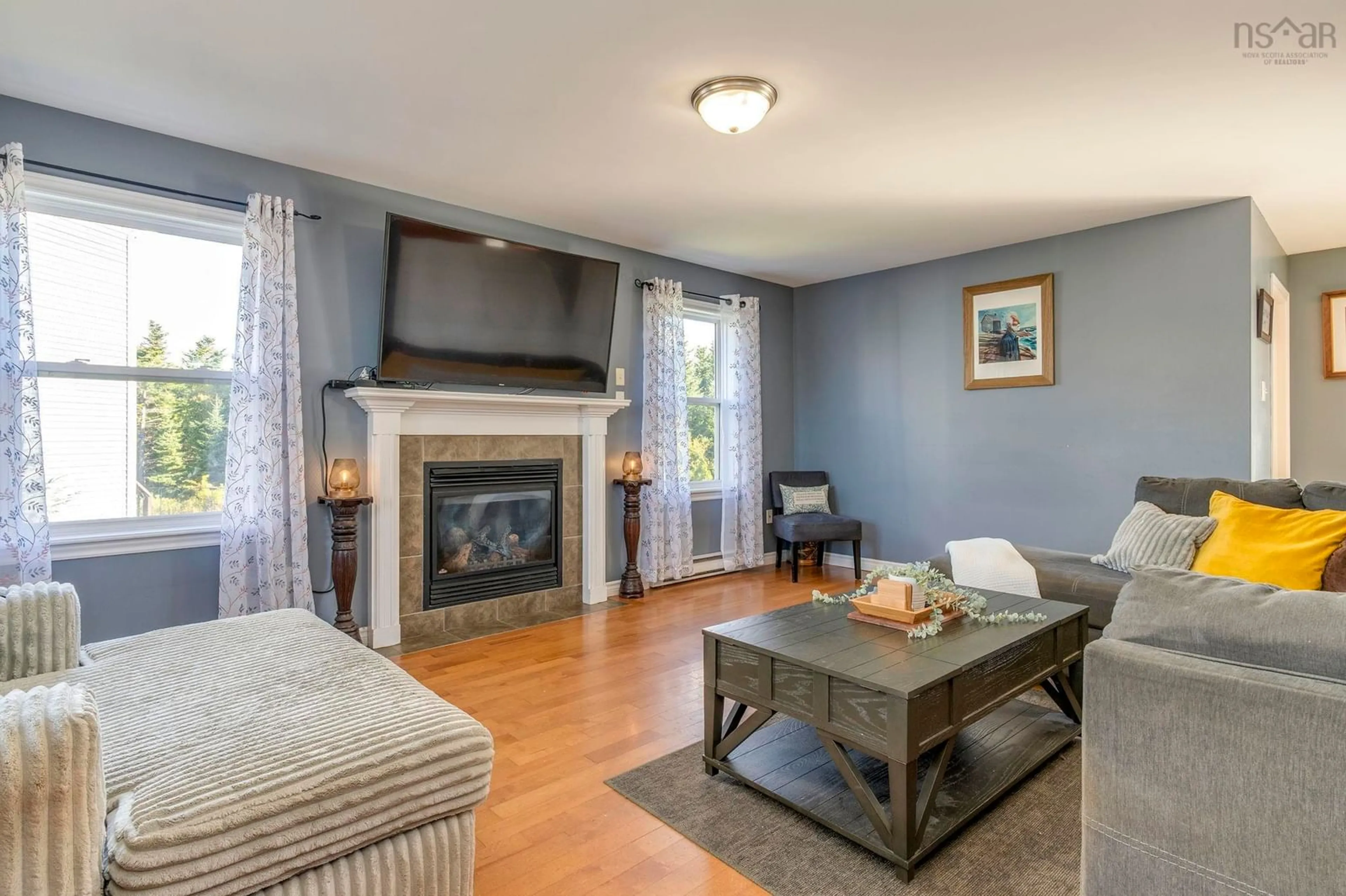 Living room with furniture, wood/laminate floor for 45 Wilmington Crt, Eastern Passage Nova Scotia B3G 0C9