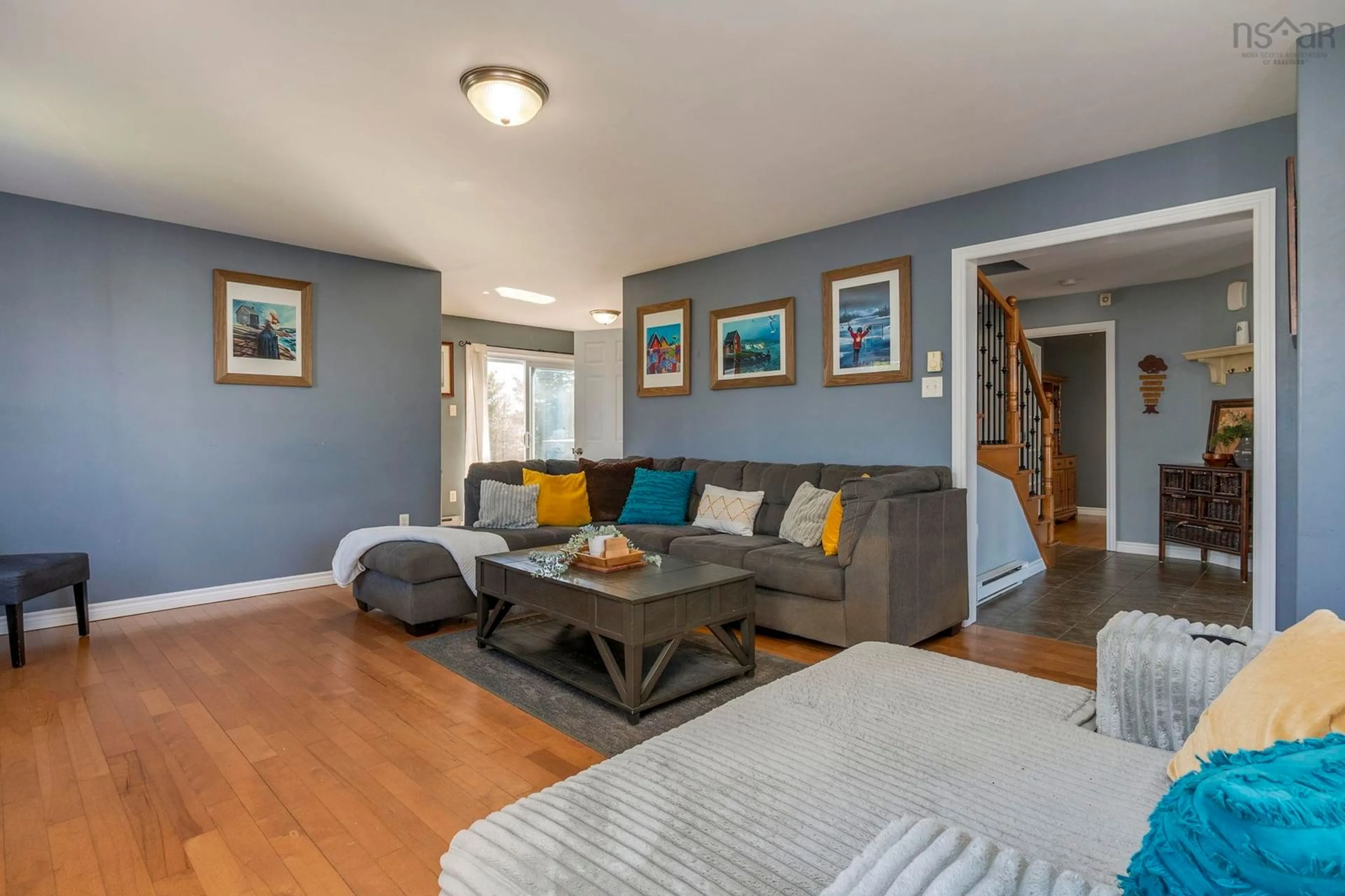 Living room with furniture, wood/laminate floor for 45 Wilmington Crt, Eastern Passage Nova Scotia B3G 0C9