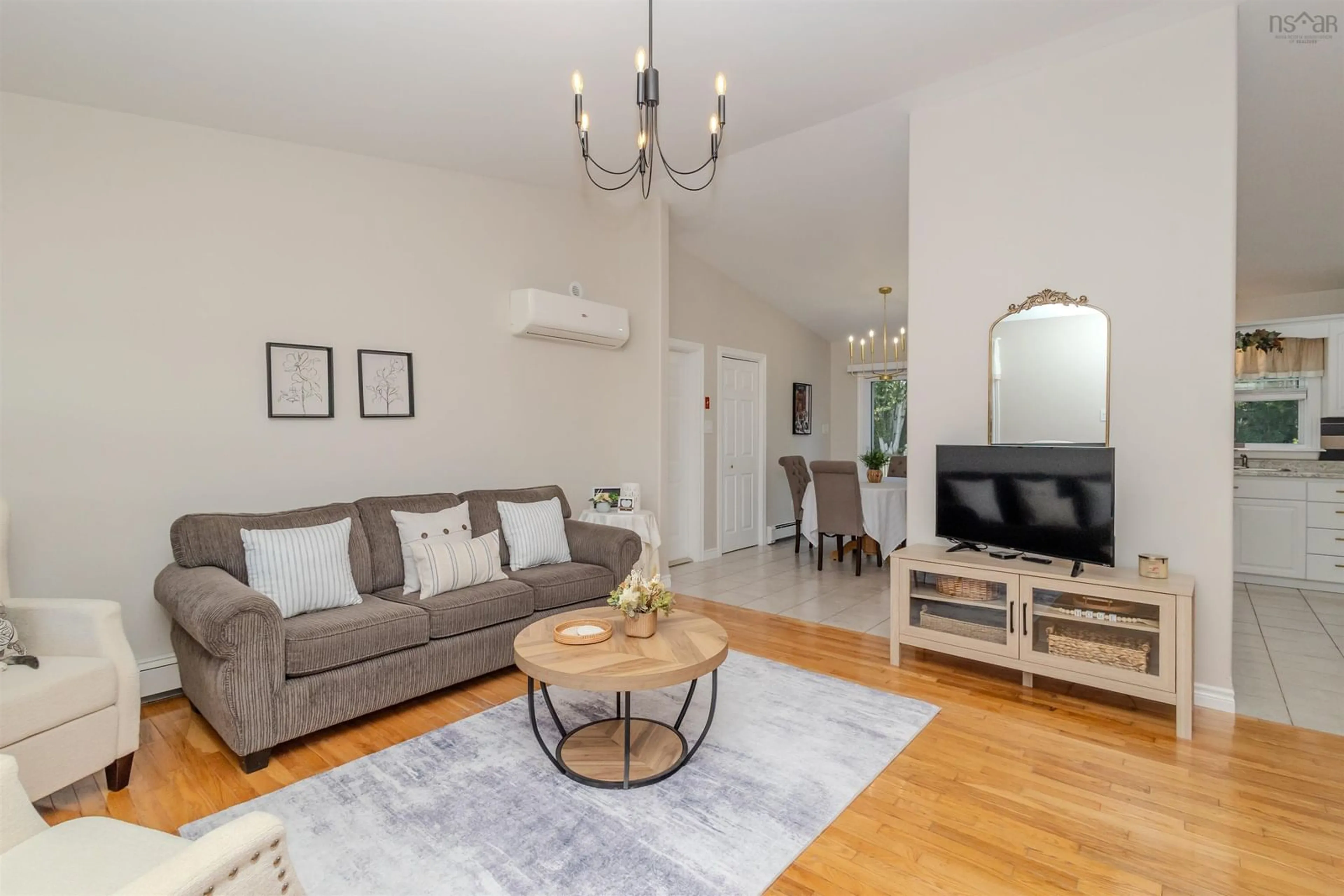 Living room with furniture, wood/laminate floor for 63 Mae Ave, Sydney Mines Nova Scotia B1V 3K8