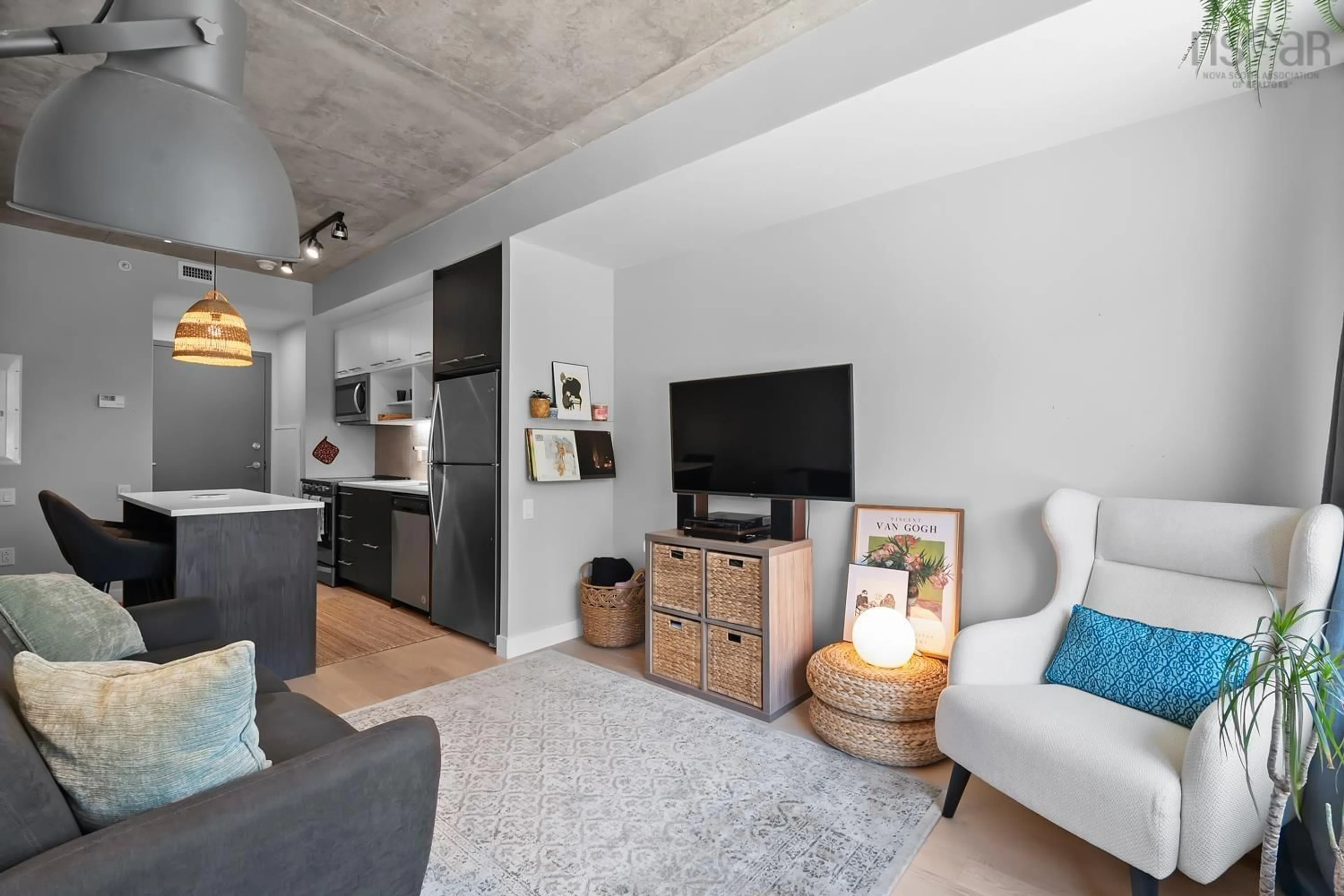 Living room with furniture, cement floor for 1048 Wellington St #207, Halifax Nova Scotia B3H 0C2