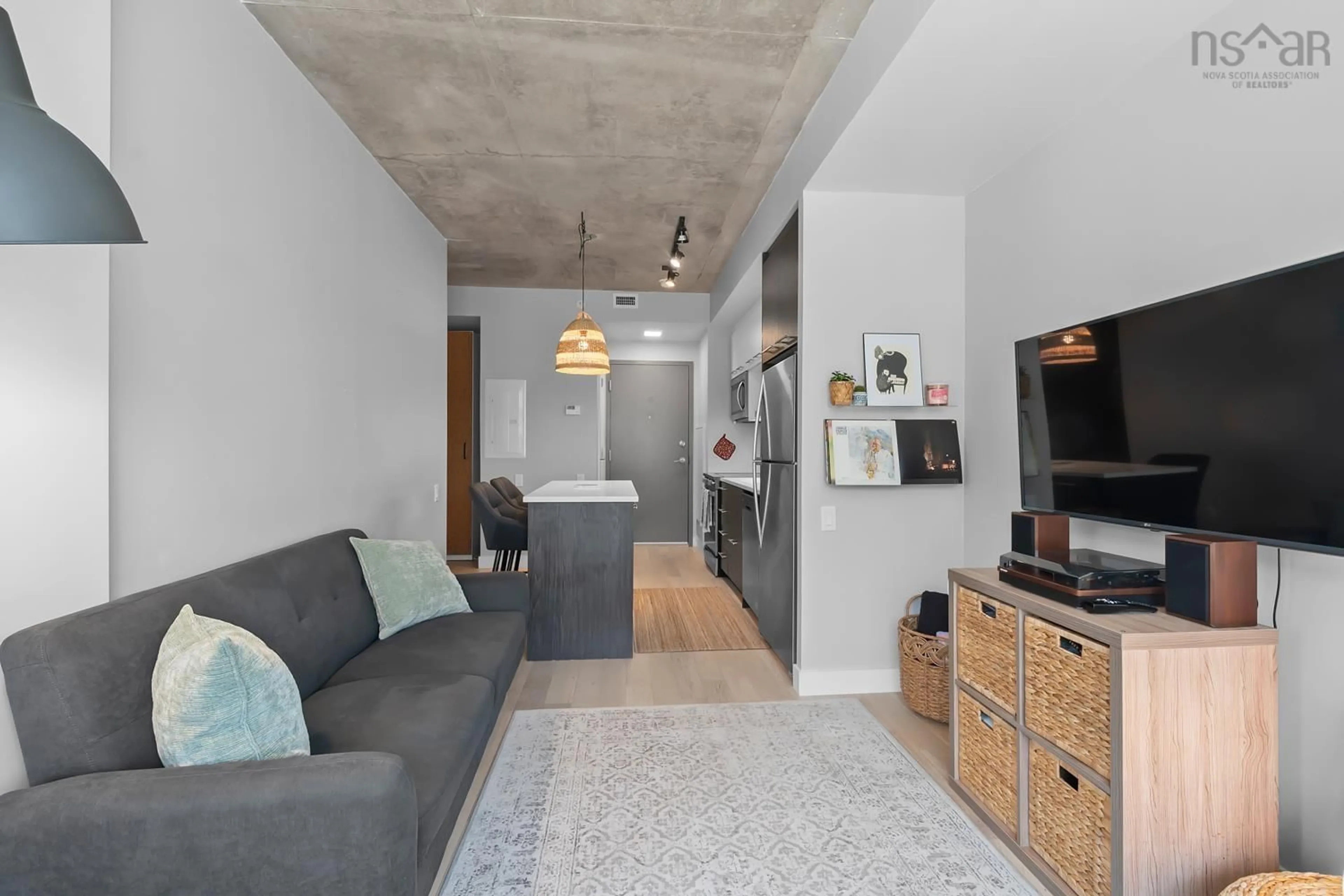Living room with furniture, cement floor for 1048 Wellington St #207, Halifax Nova Scotia B3H 0C2