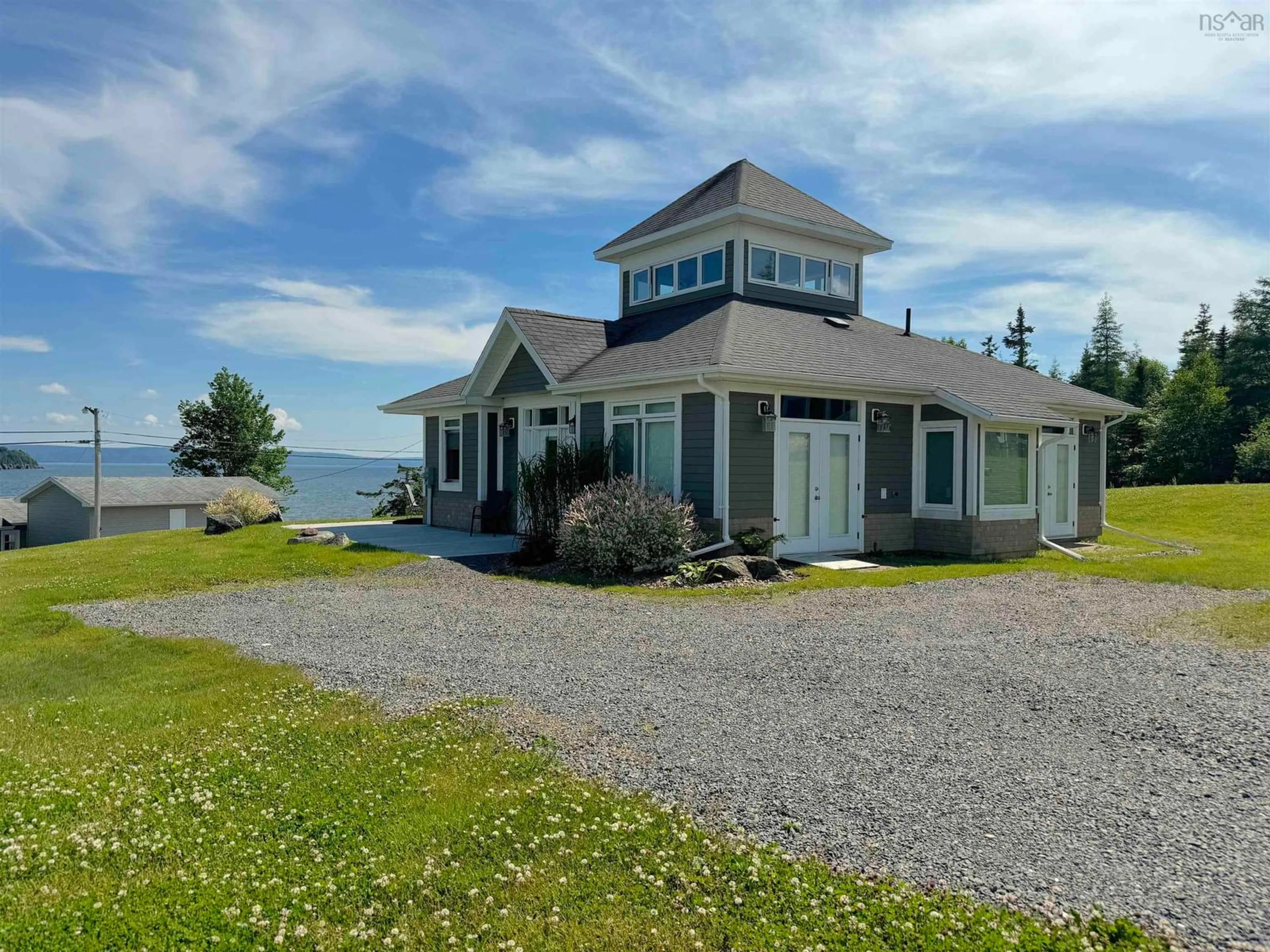 A pic from outside/outdoor area/front of a property/back of a property/a pic from drone, water/lake/river/ocean view for 7 Bell Bay Way, Baddeck Nova Scotia B0C 1H0