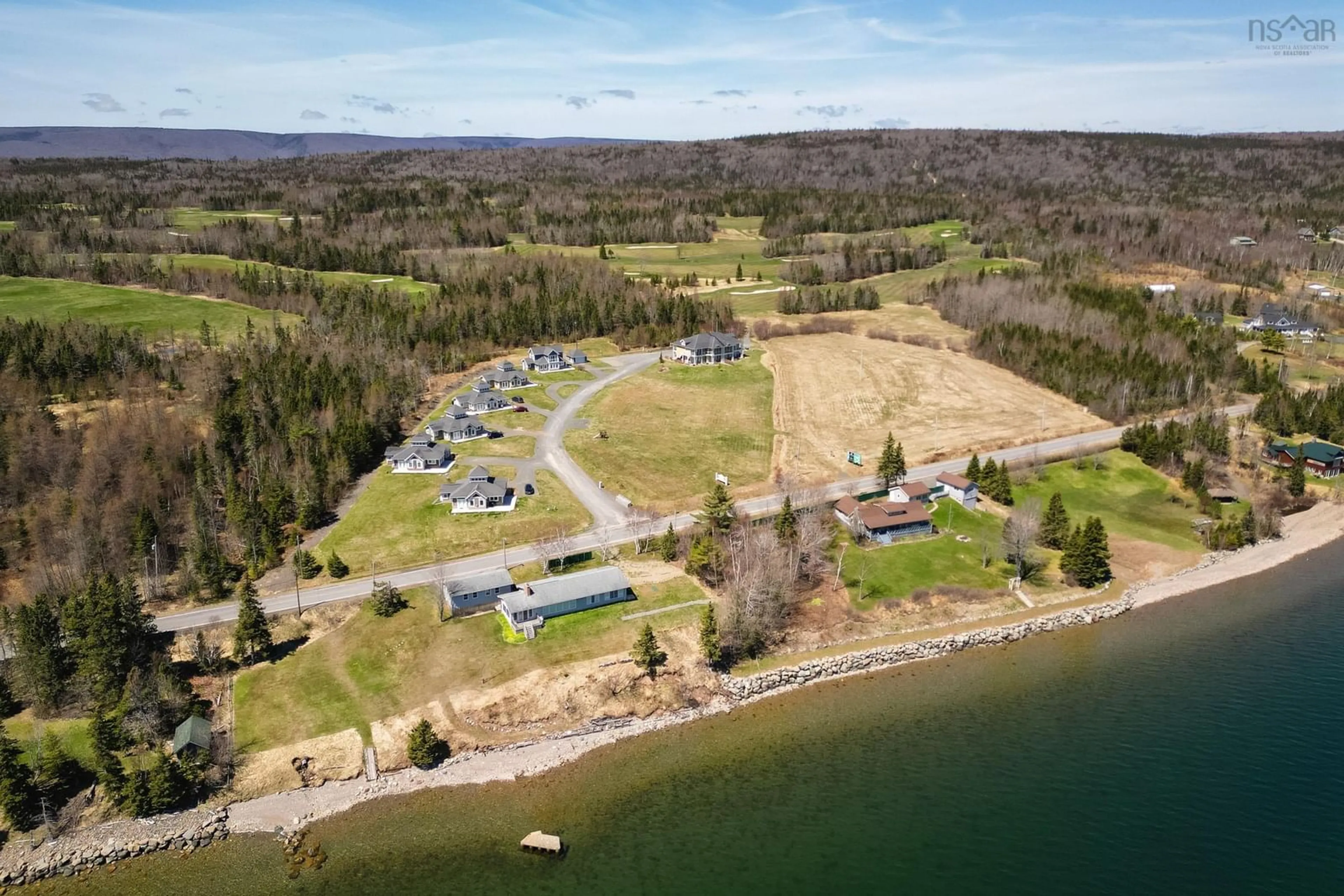 A pic from outside/outdoor area/front of a property/back of a property/a pic from drone, water/lake/river/ocean view for 7 Bell Bay Way, Baddeck Nova Scotia B0C 1H0