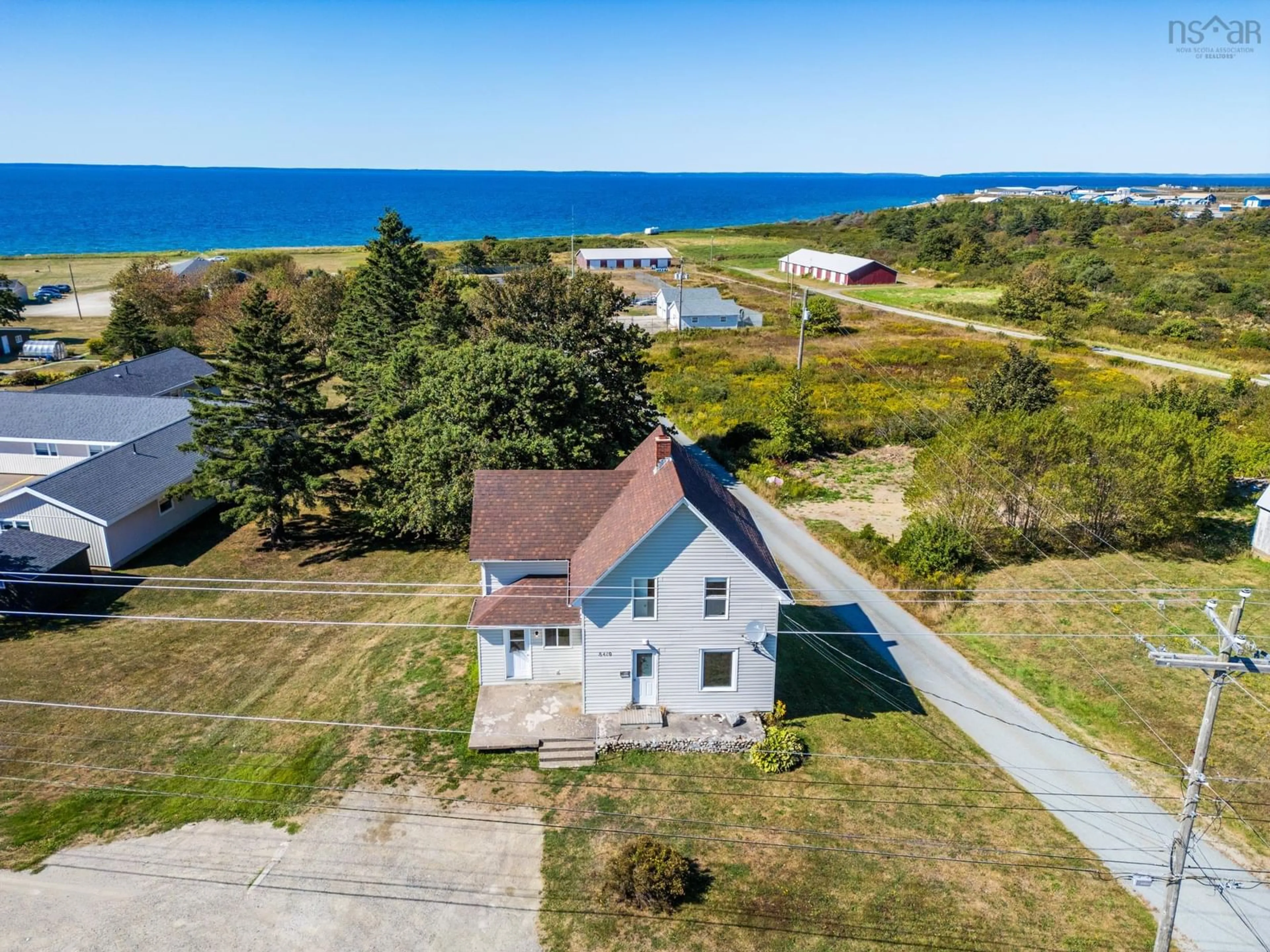 A pic from outside/outdoor area/front of a property/back of a property/a pic from drone, water/lake/river/ocean view for 8419 Highway 1, Meteghan Nova Scotia B0W 2L0