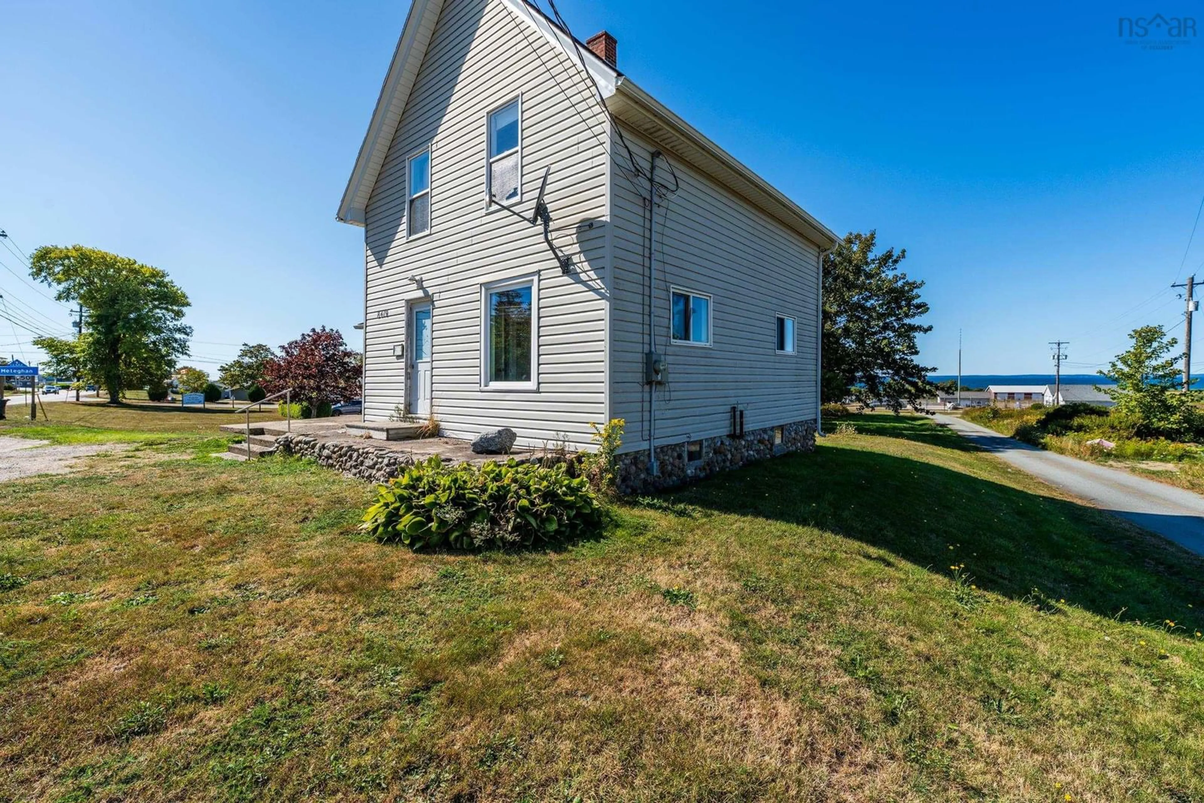 A pic from outside/outdoor area/front of a property/back of a property/a pic from drone, unknown for 8419 Highway 1, Meteghan Nova Scotia B0W 2L0