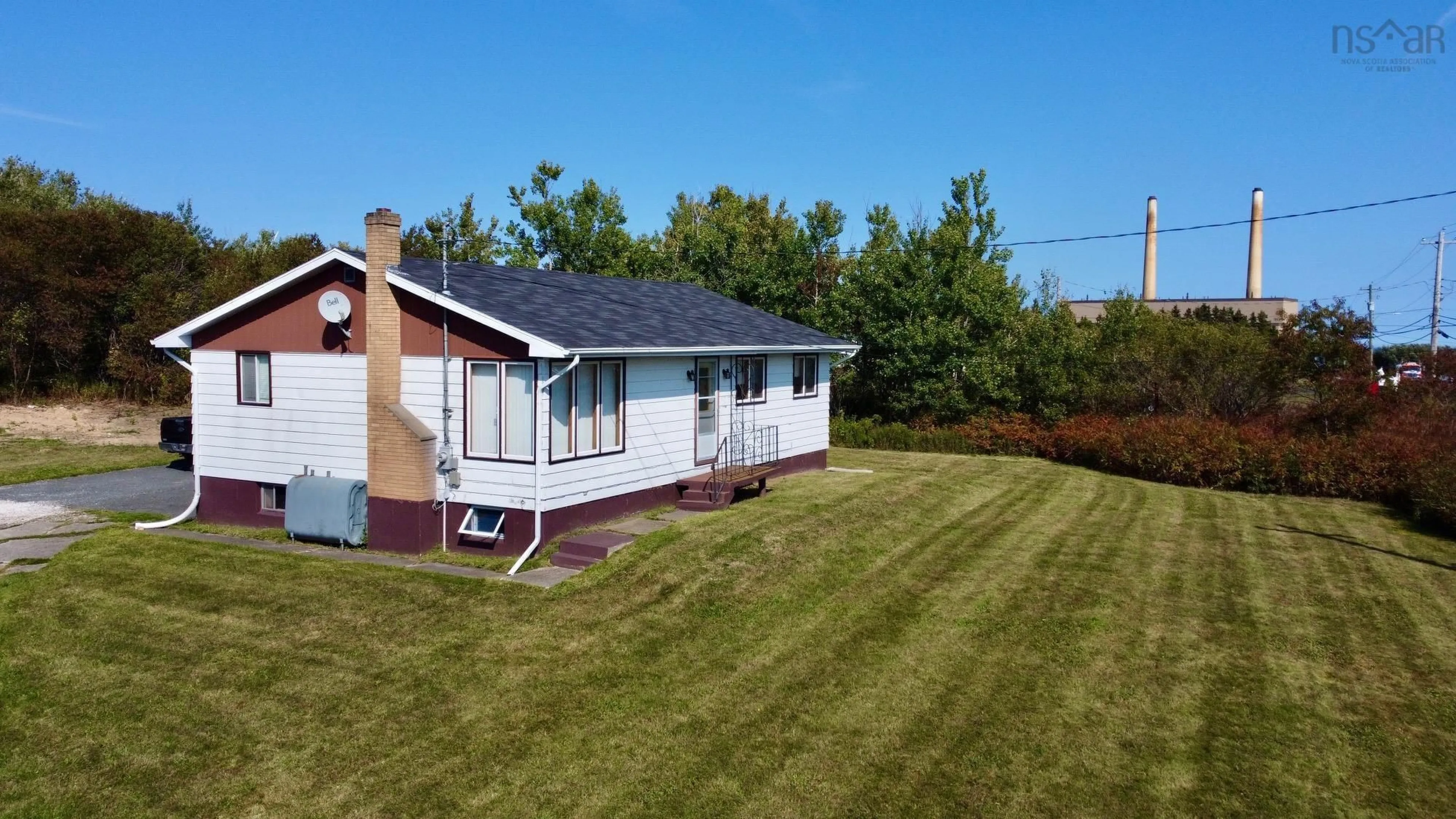 A pic from outside/outdoor area/front of a property/back of a property/a pic from drone, unknown for 2695 Lingan Rd, Lingan Nova Scotia B1H 5E7