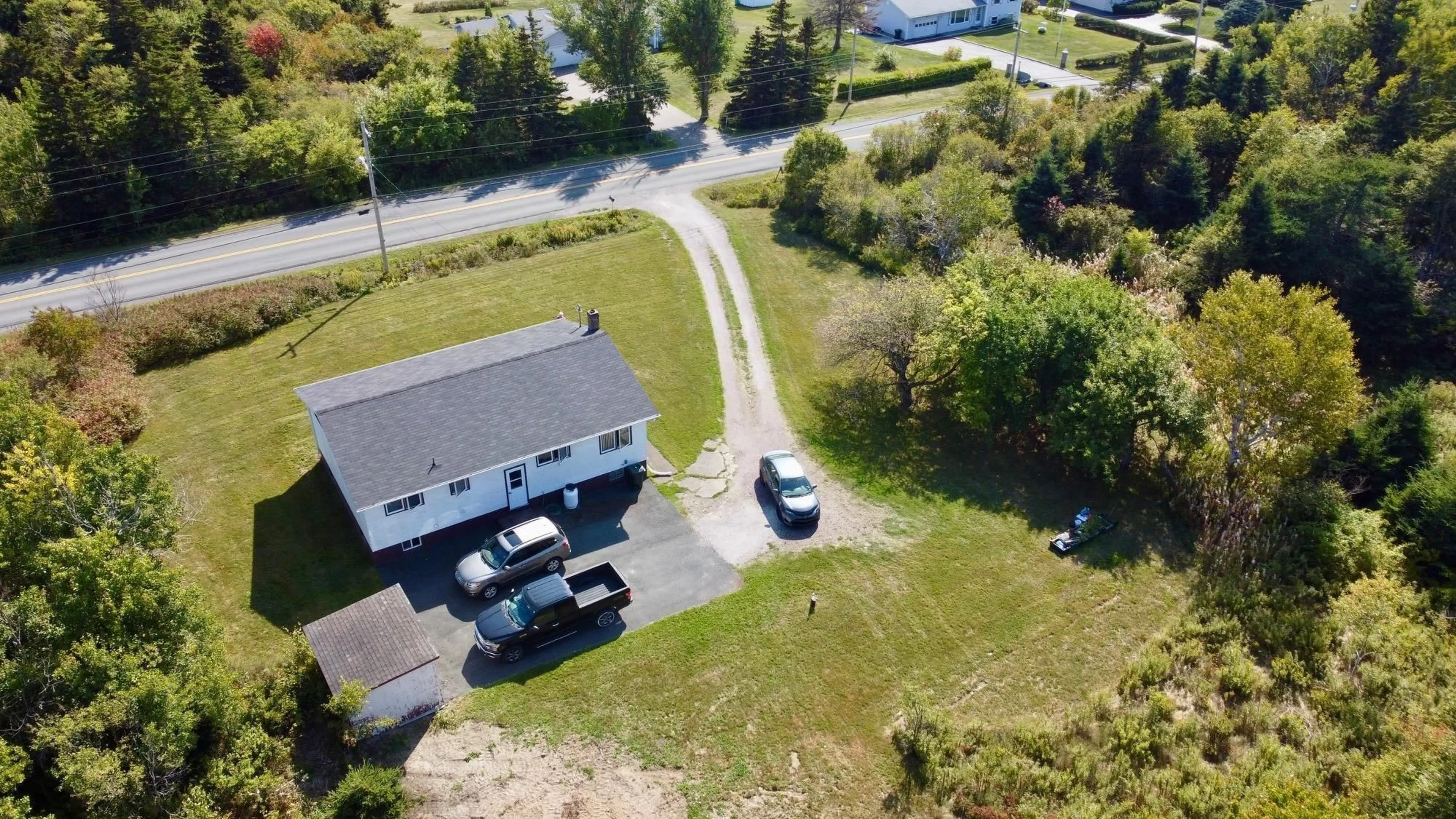 A pic from outside/outdoor area/front of a property/back of a property/a pic from drone, street for 2695 Lingan Rd, Lingan Nova Scotia B1H 5E7