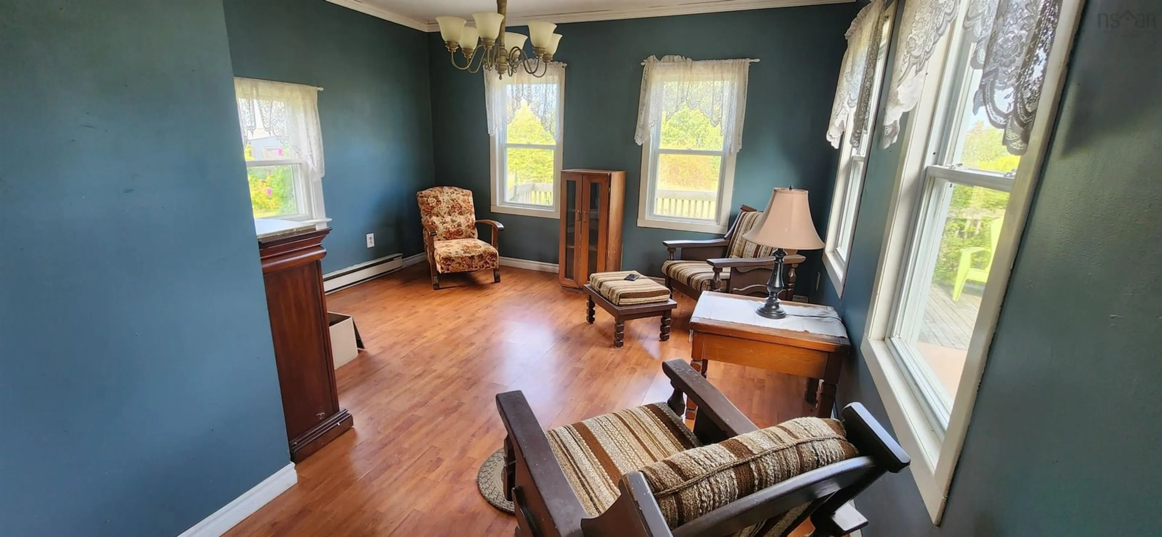 Living room with furniture, wood/laminate floor for 2003 Ridge Rd, Melanson Nova Scotia B4P 2R1