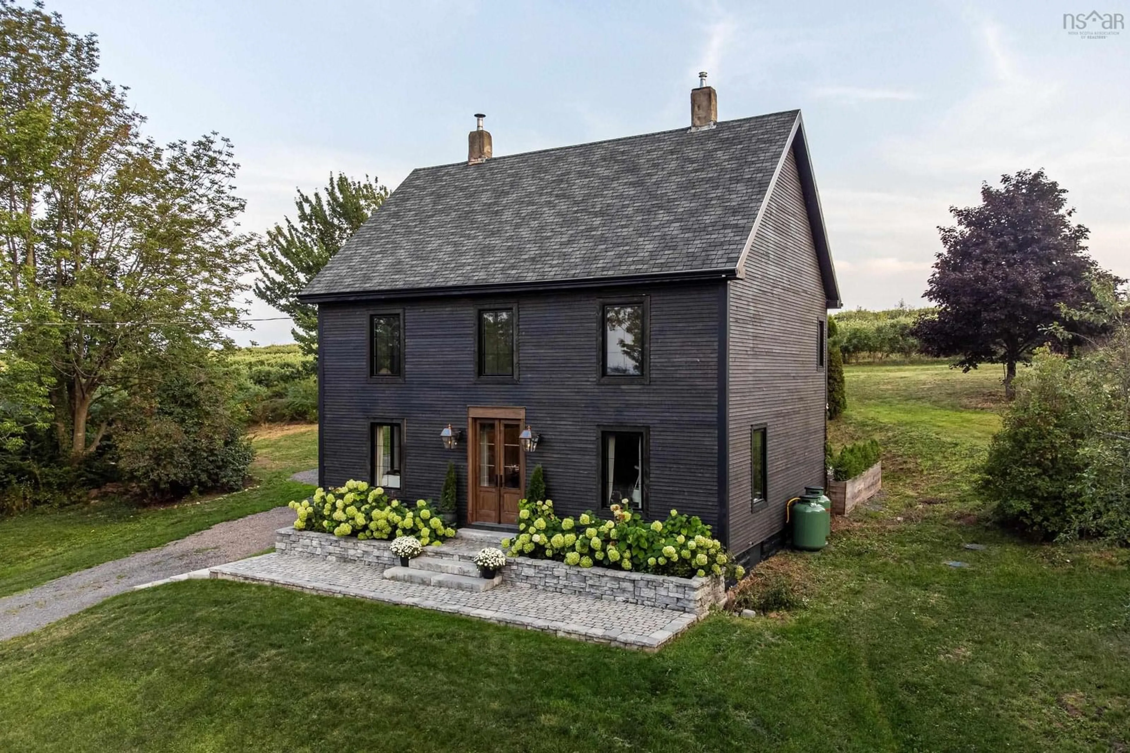 Home with brick exterior material, street for 11820 Highway 1, Grand Pré Nova Scotia B0P 1M0