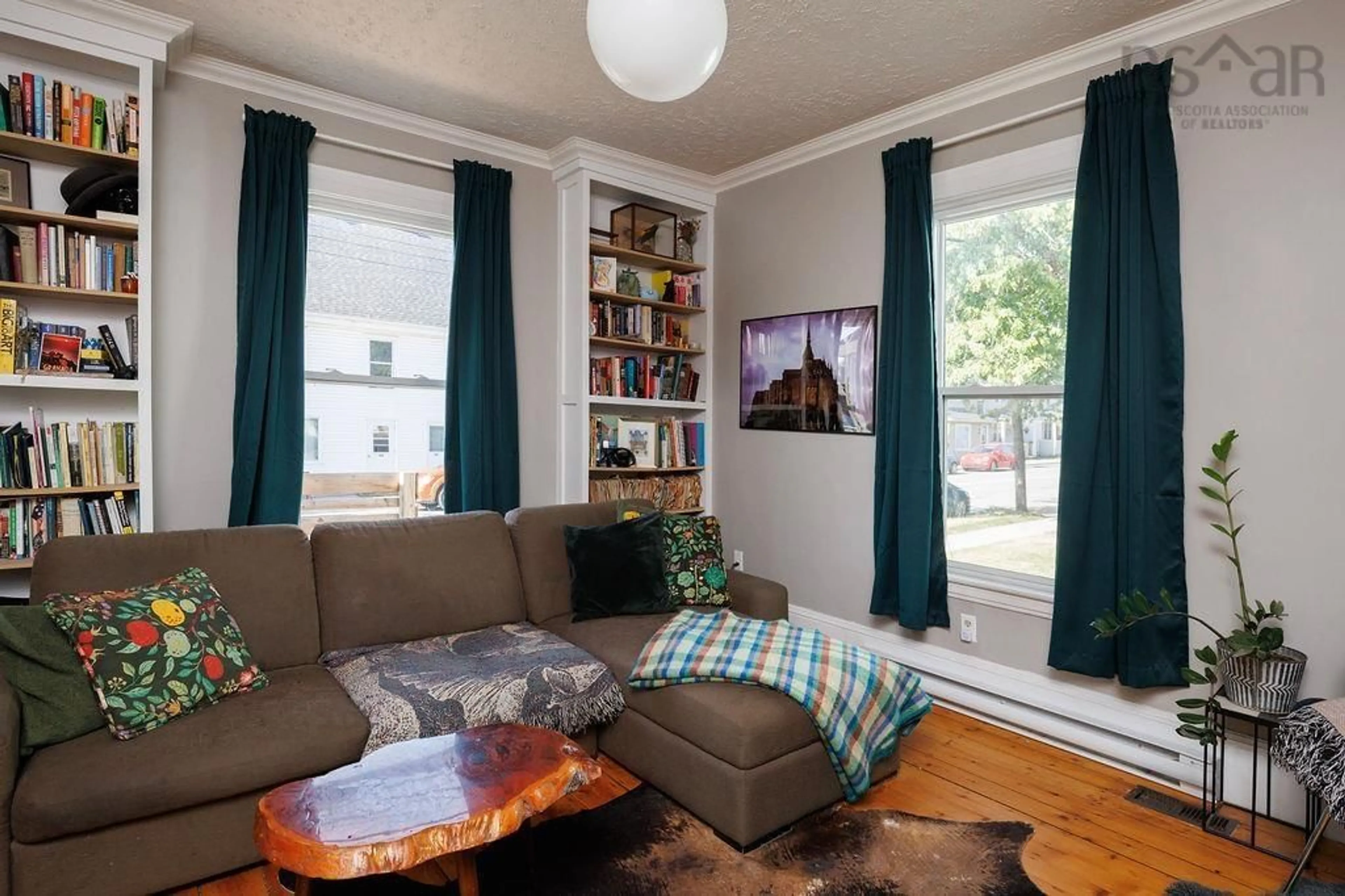 Living room with furniture, wood/laminate floor for 307 Gerrish St, Windsor Nova Scotia B0N 2T0