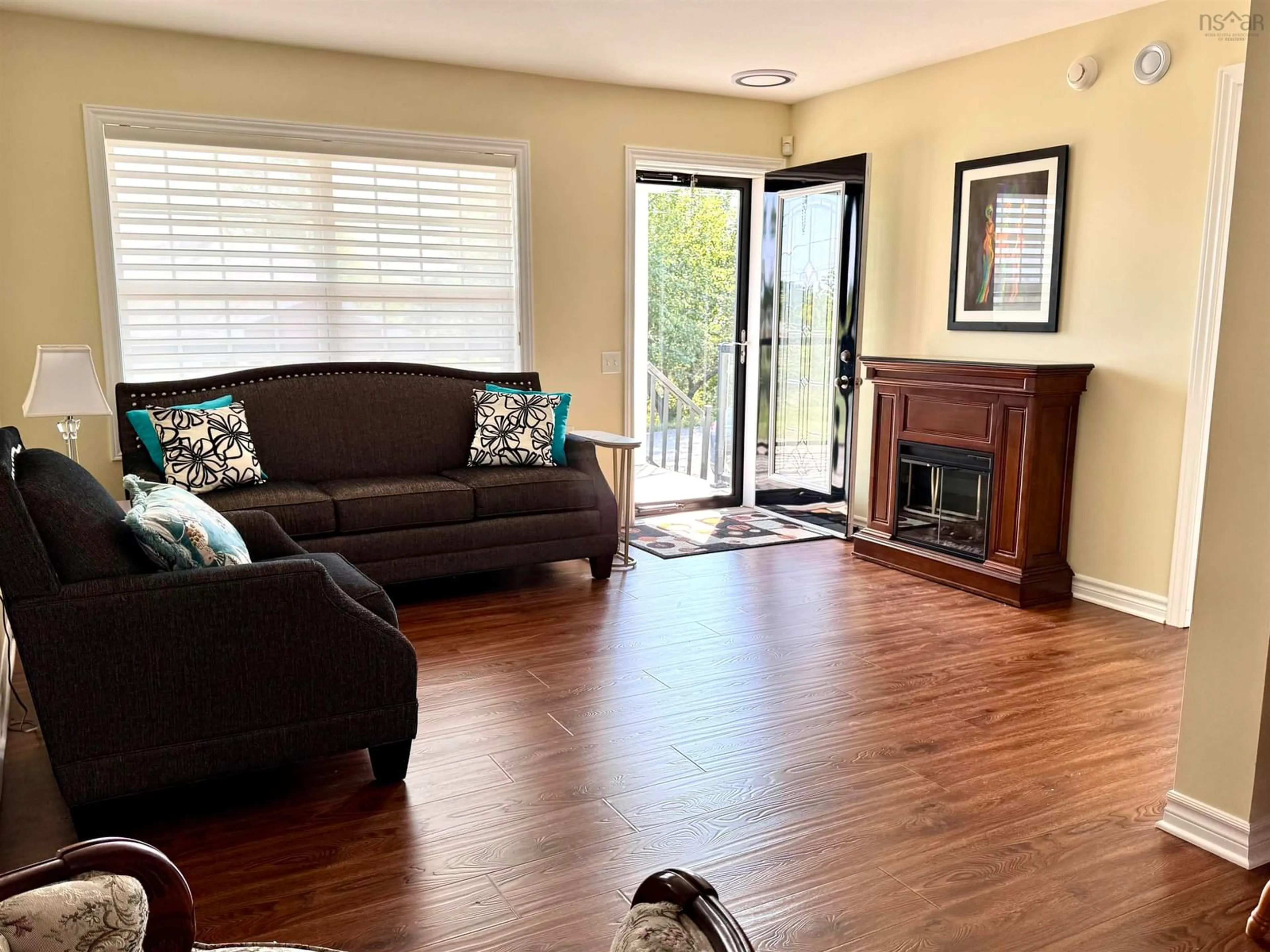 Living room with furniture, wood/laminate floor for 16 Melrose Ave, Glace Bay Nova Scotia B1A 5G2