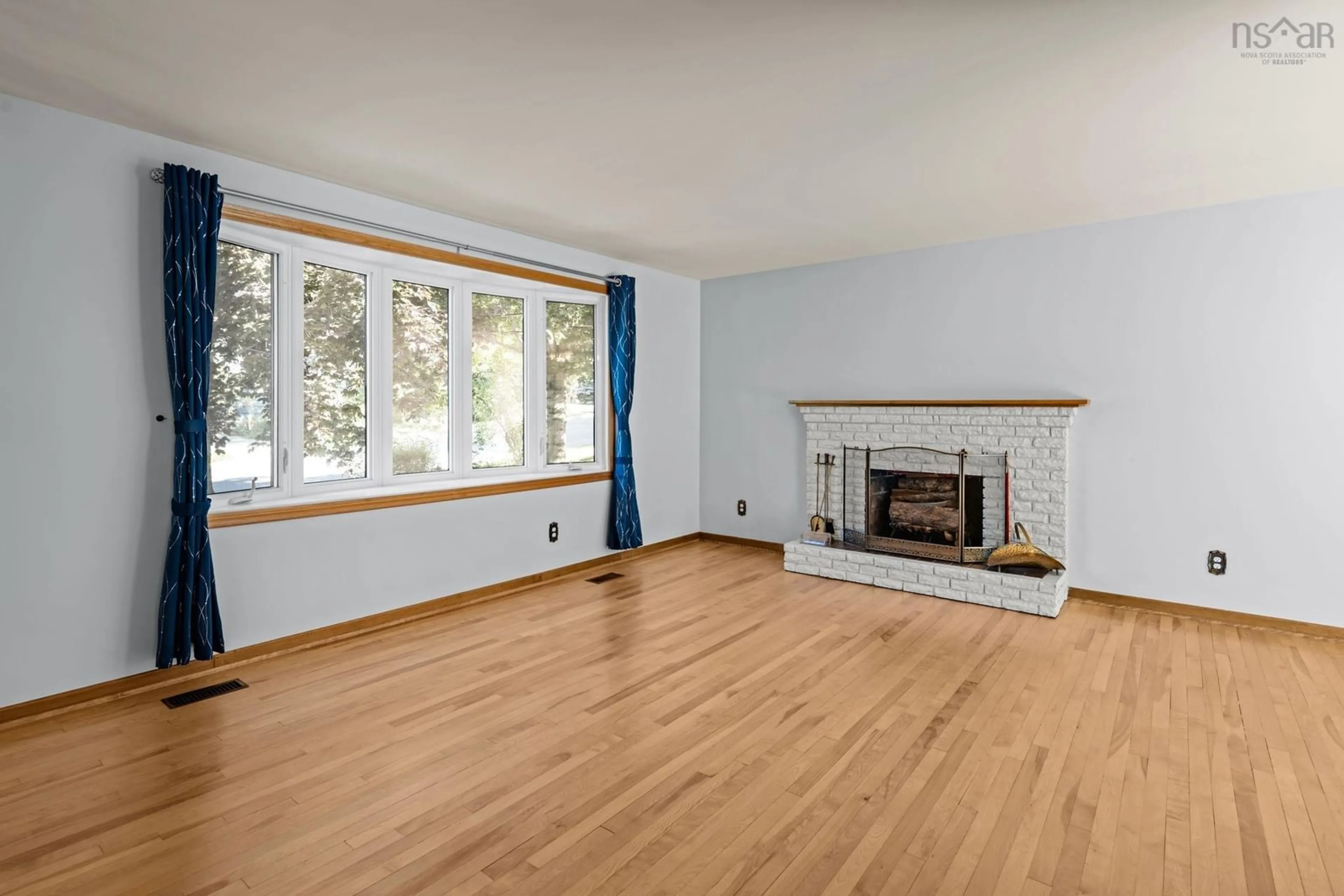 Living room with furniture, wood/laminate floor for 19 Gourok Ave, Halifax Nova Scotia B2X 2B1