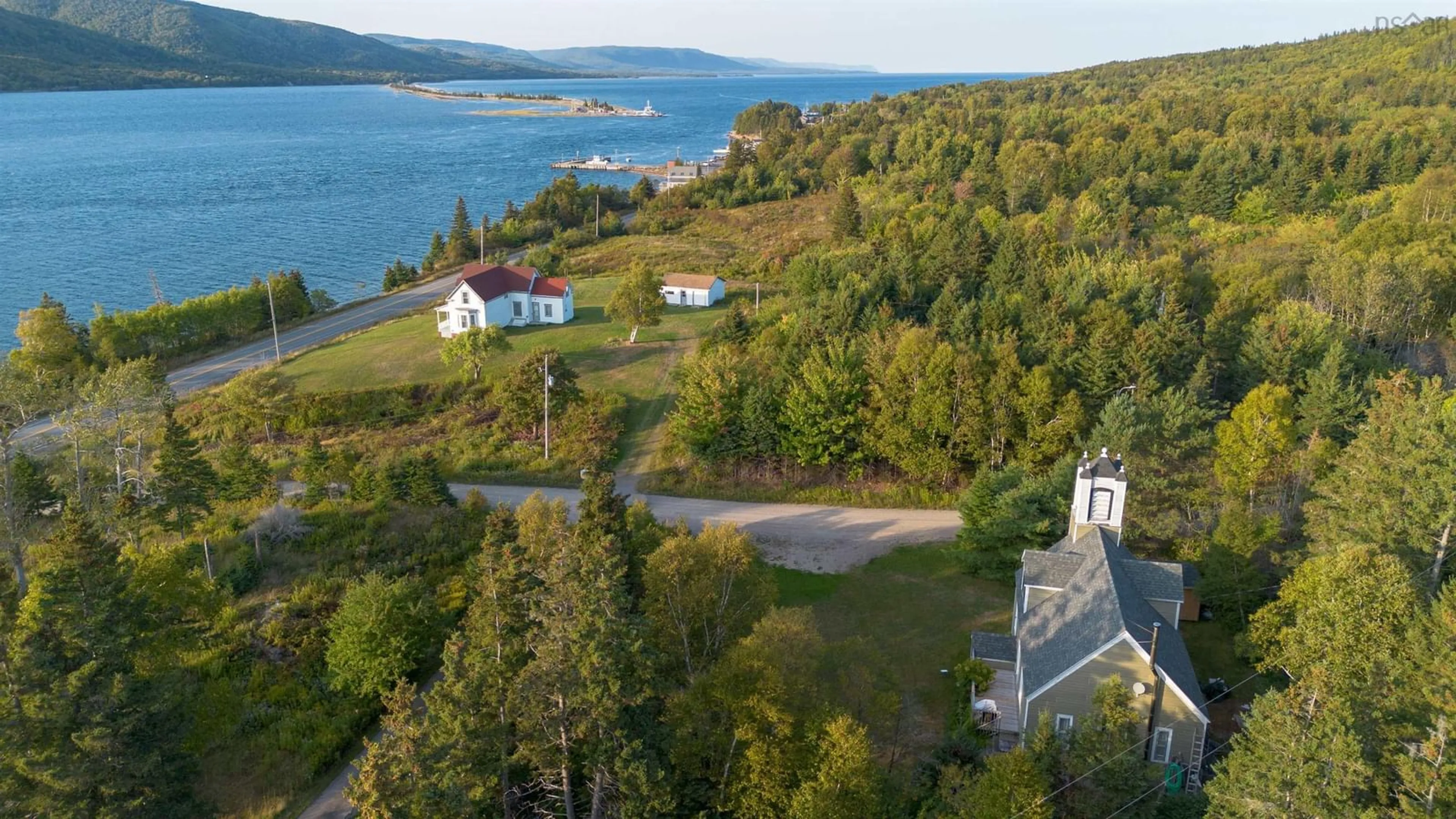 A pic from outside/outdoor area/front of a property/back of a property/a pic from drone, water/lake/river/ocean view for 18 Kellys Lane, Englishtown Nova Scotia B0C 1H0