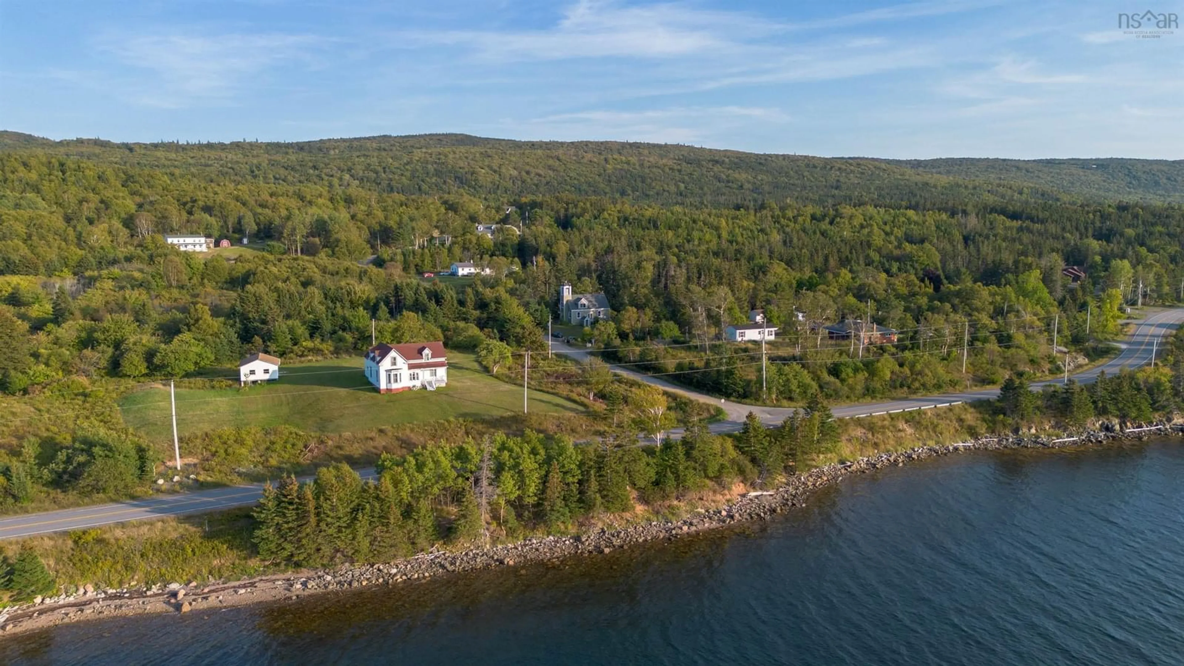 A pic from outside/outdoor area/front of a property/back of a property/a pic from drone, water/lake/river/ocean view for 18 Kellys Lane, Englishtown Nova Scotia B0C 1H0