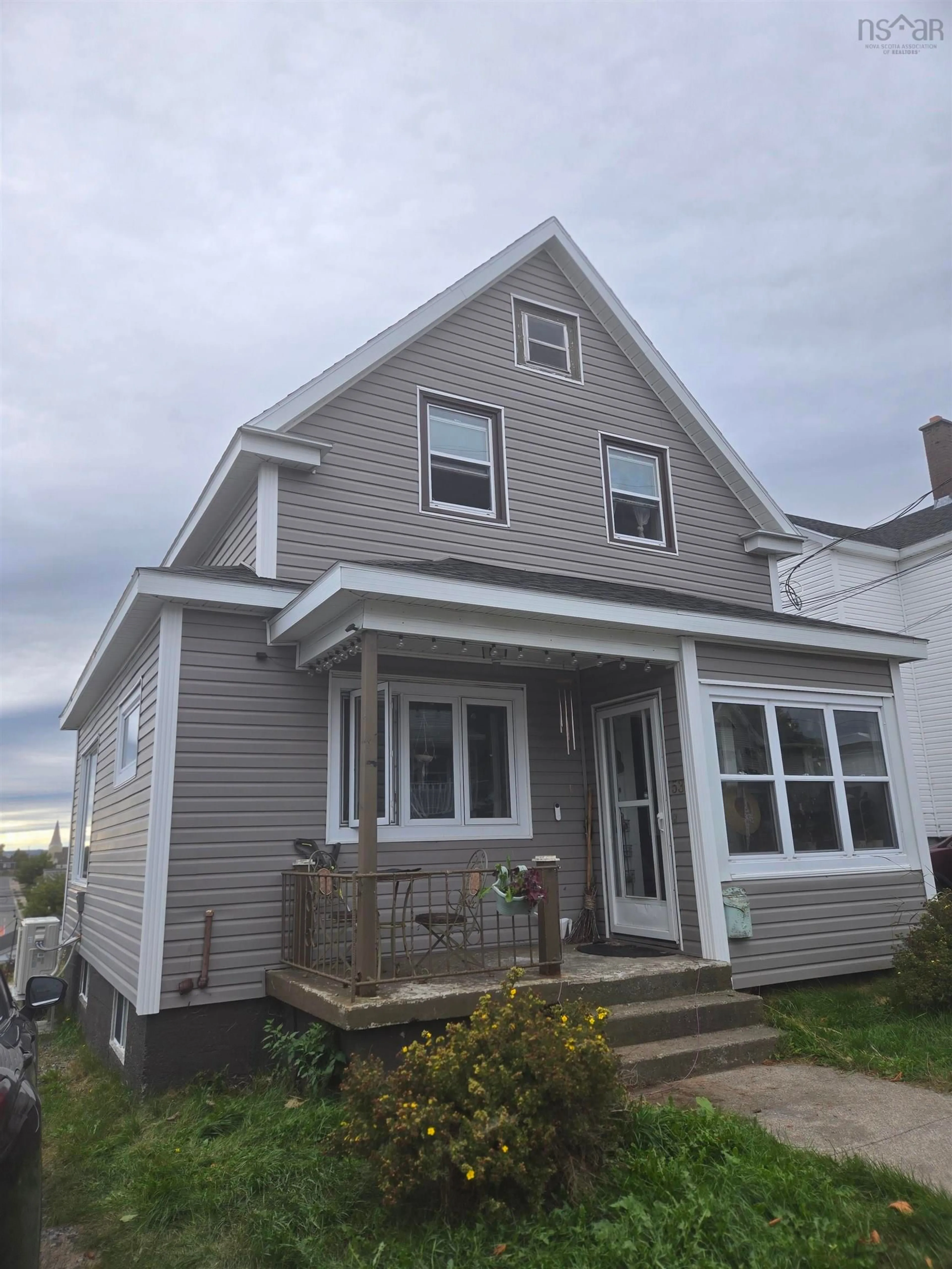 Home with vinyl exterior material, street for 53 East St, Sydney Nova Scotia B1N 1S7