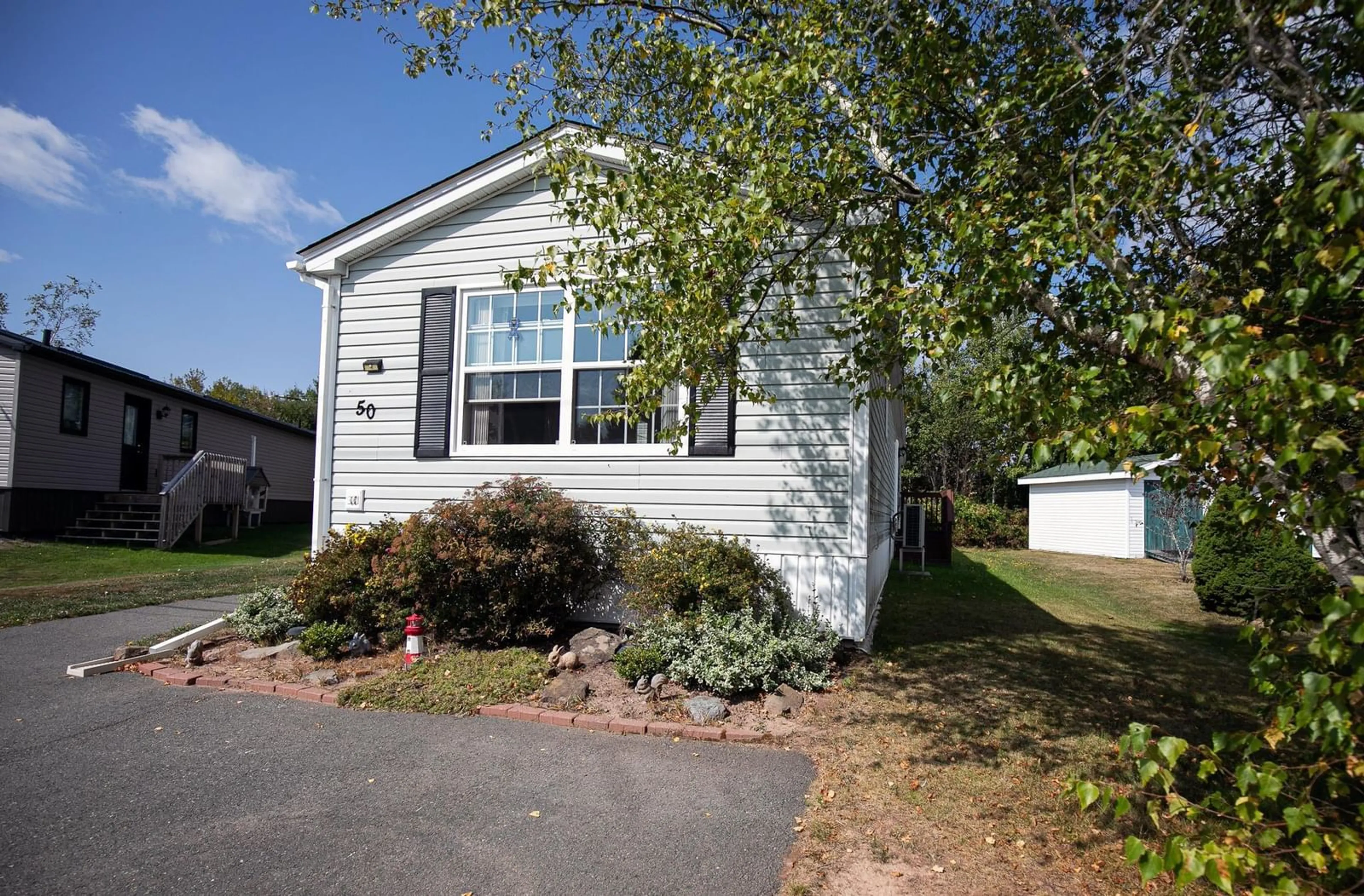 Home with vinyl exterior material, street for 50 Pinehurst St, Amherst Nova Scotia B4H 4X4