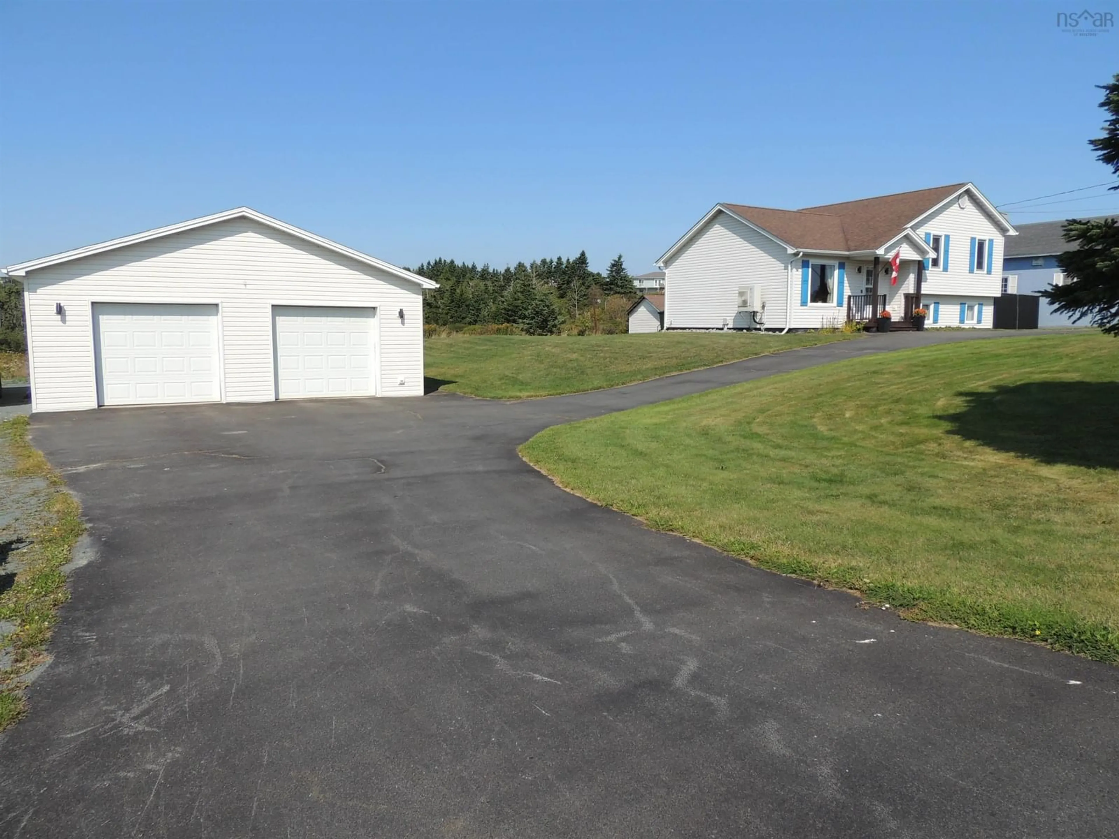 A pic from outside/outdoor area/front of a property/back of a property/a pic from drone, street for 1534 Cow Bay Rd, Cow Bay Nova Scotia B3G 1L3