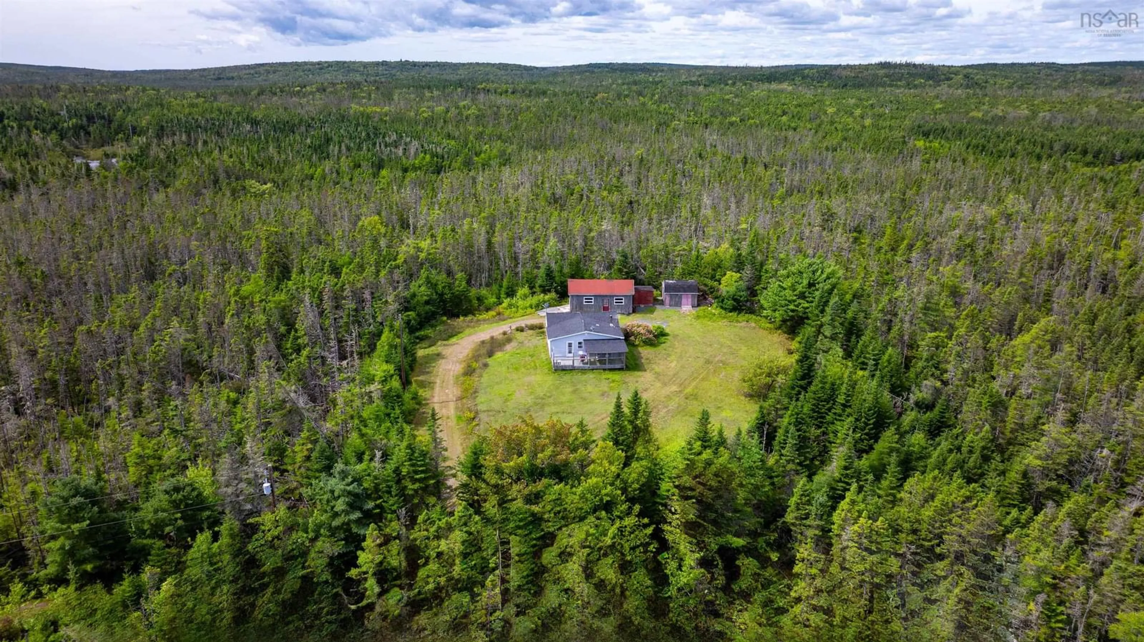 A pic from outside/outdoor area/front of a property/back of a property/a pic from drone, forest/trees view for 28507 7 Hwy, Moser River Nova Scotia B0J 2K0
