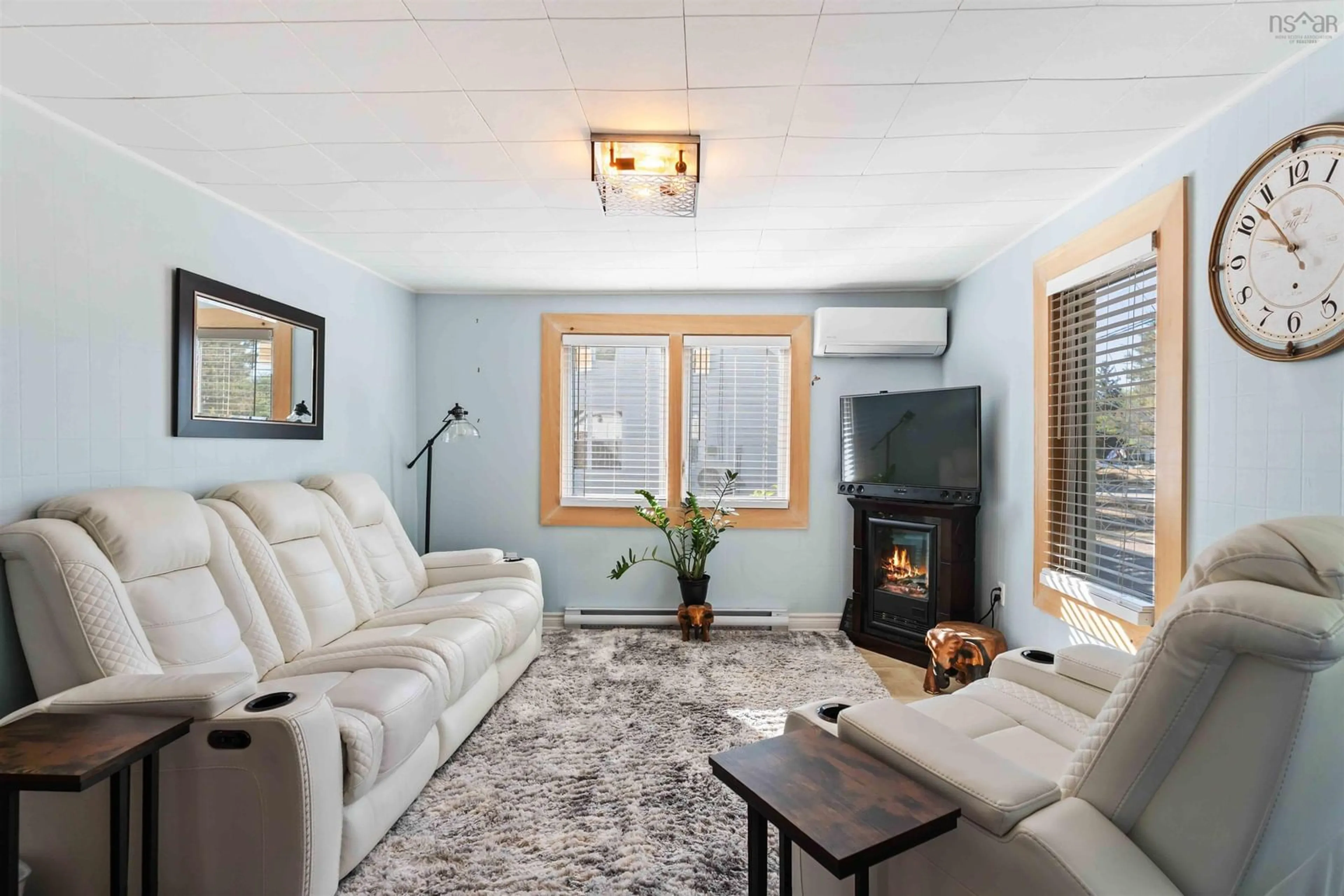 Living room with furniture, wood/laminate floor for 1400 Marshall Rd, Kingston Nova Scotia B0P 1R0