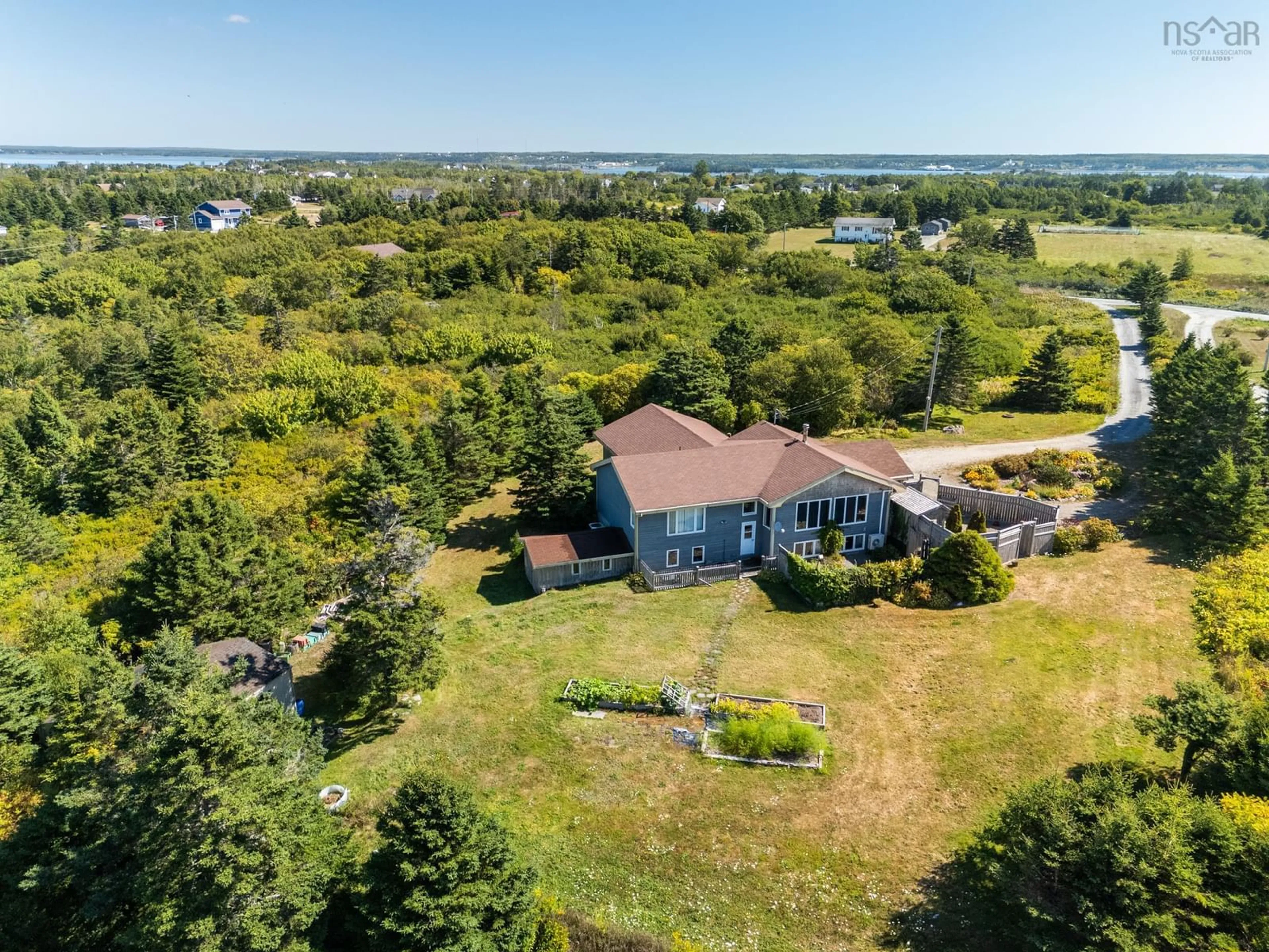 A pic from outside/outdoor area/front of a property/back of a property/a pic from drone, water/lake/river/ocean view for 40 Country Lane, Lower West Pubnico Nova Scotia B0W 2C0