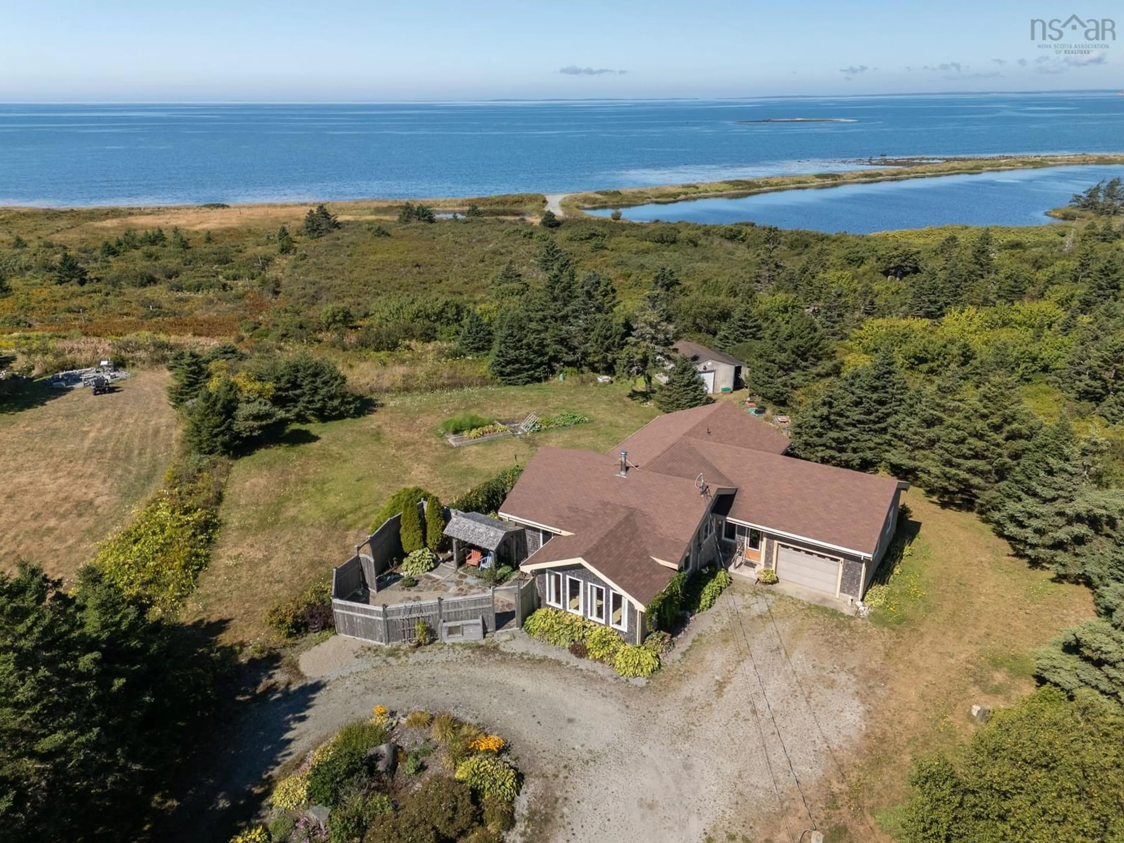 A pic from outside/outdoor area/front of a property/back of a property/a pic from drone, water/lake/river/ocean view for 40 Country Lane, Lower West Pubnico Nova Scotia B0W 2C0