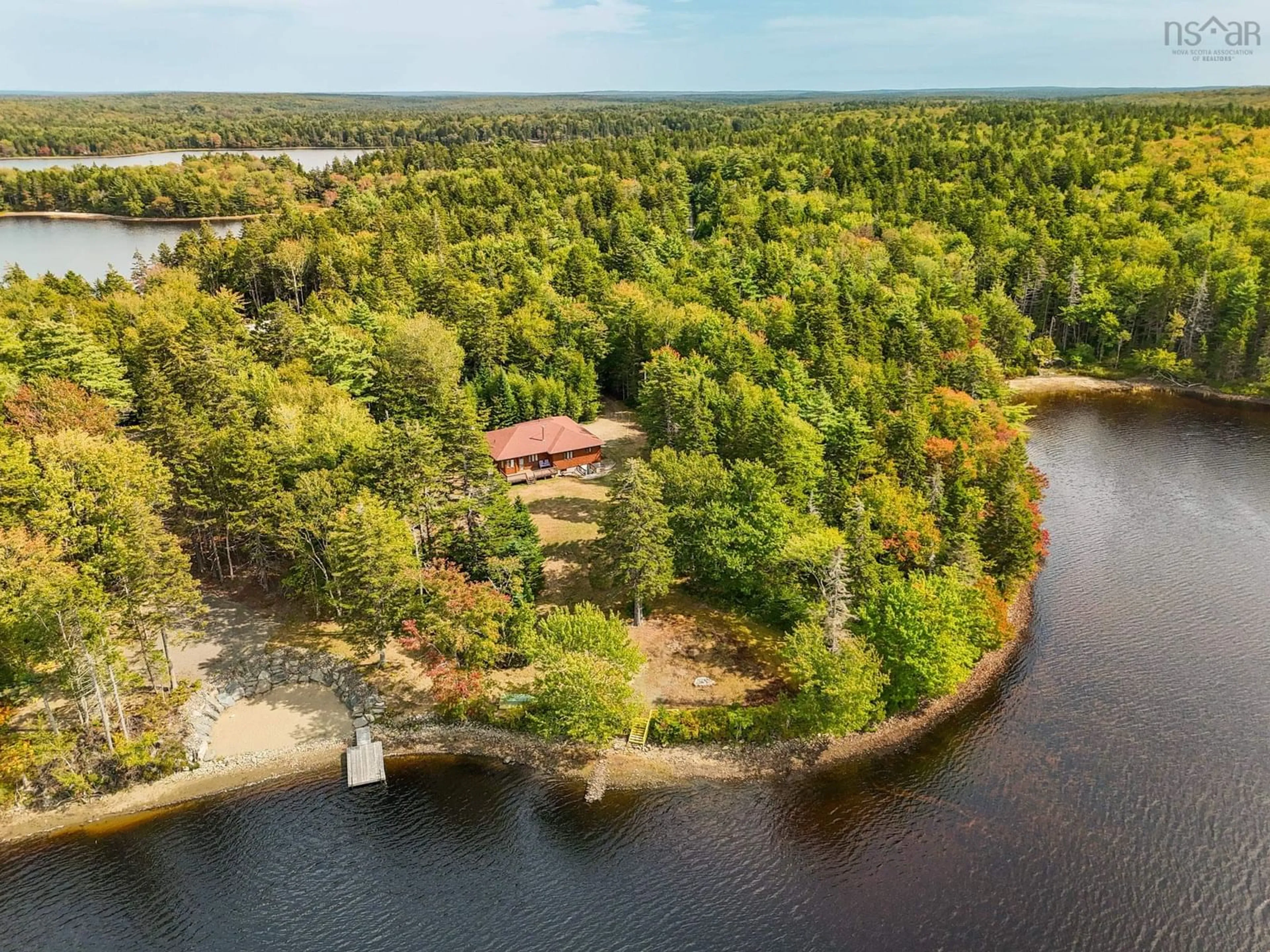 A pic from outside/outdoor area/front of a property/back of a property/a pic from drone, water/lake/river/ocean view for 151 Lake Shore Dr, Briar Lake Nova Scotia B0W 3T0