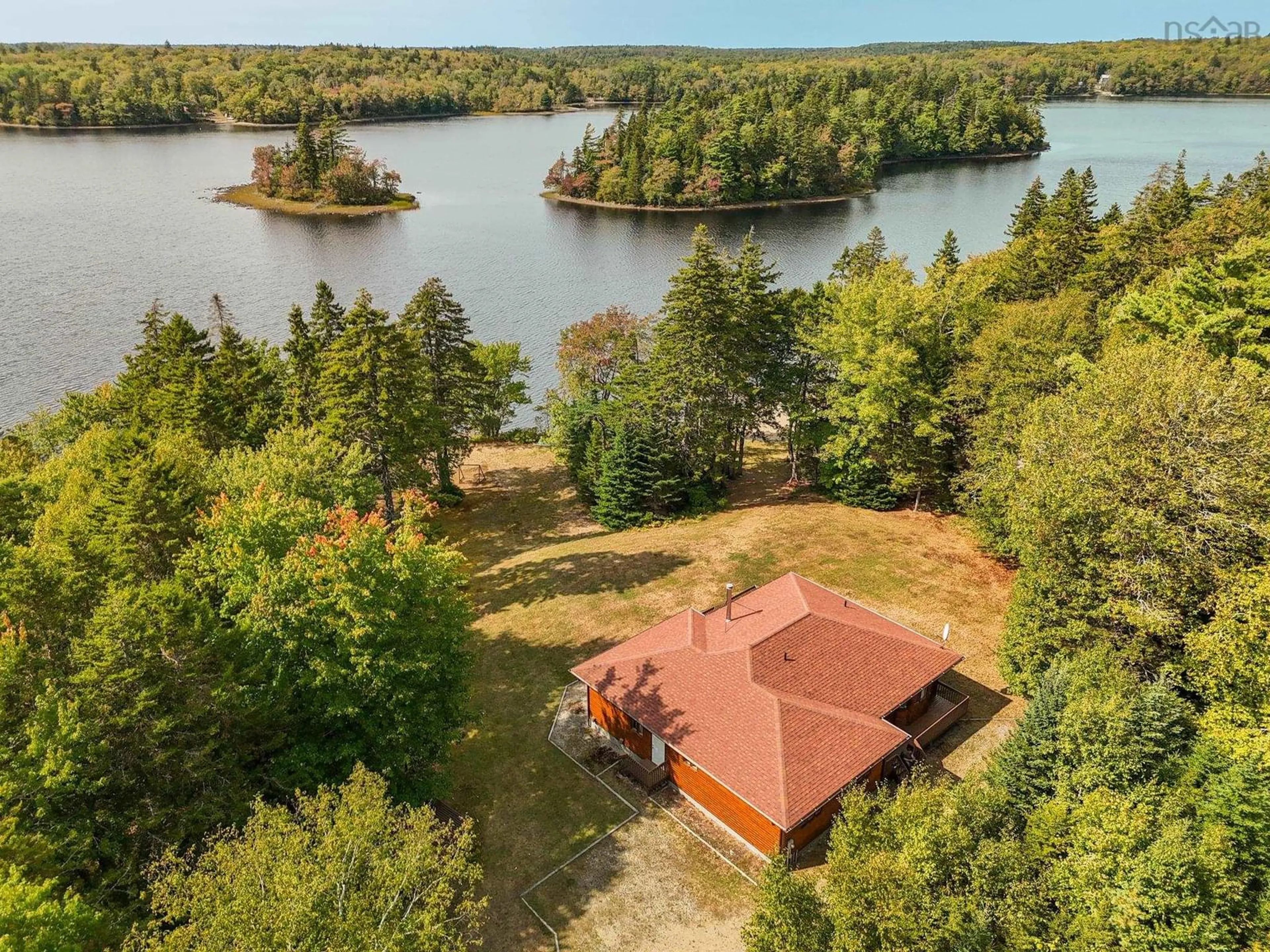 A pic from outside/outdoor area/front of a property/back of a property/a pic from drone, water/lake/river/ocean view for 151 Lake Shore Dr, Briar Lake Nova Scotia B0W 3T0