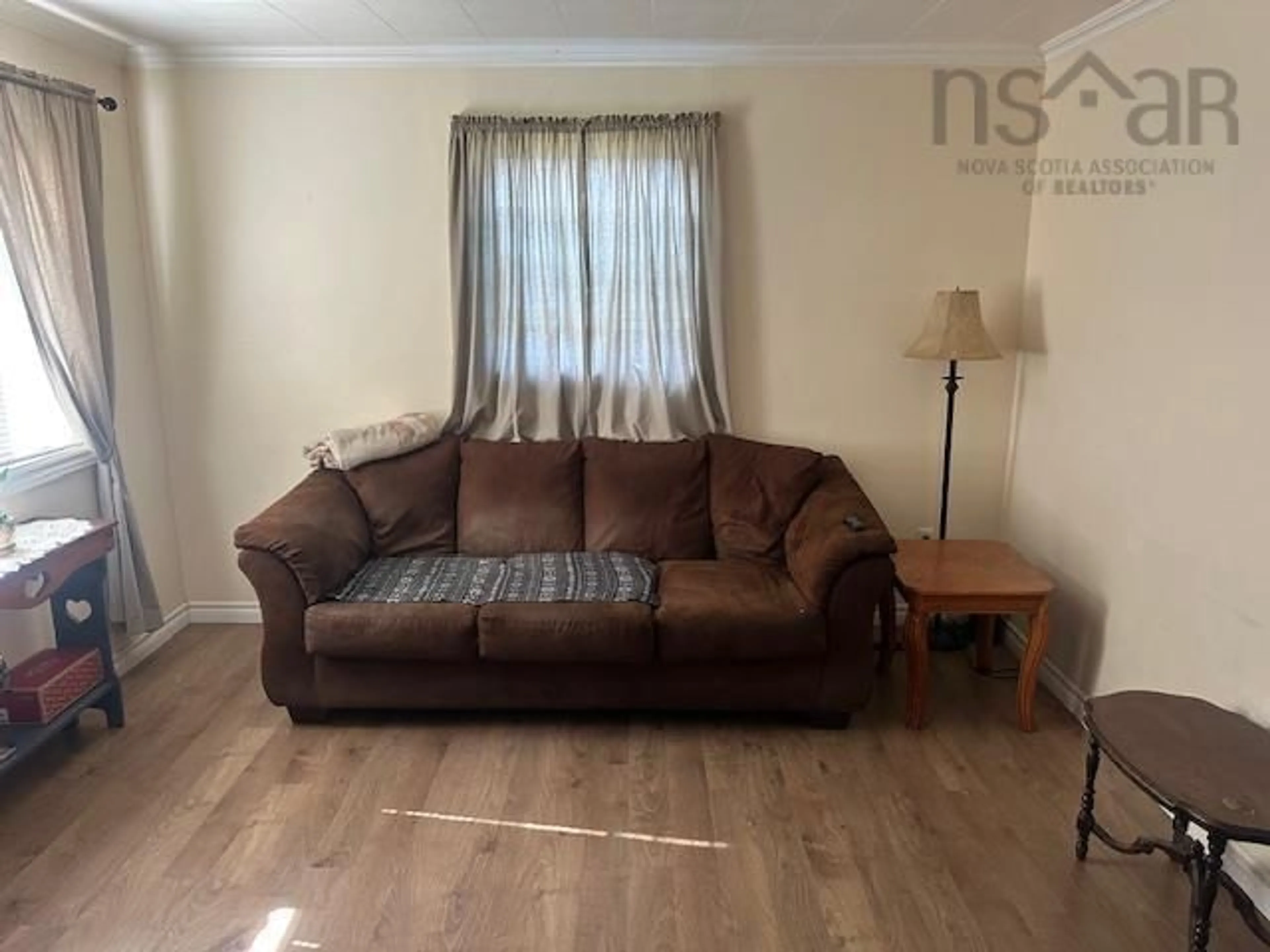 Living room with furniture, wood/laminate floor for 29 Dickie St, Trenton Nova Scotia B0K 1X0