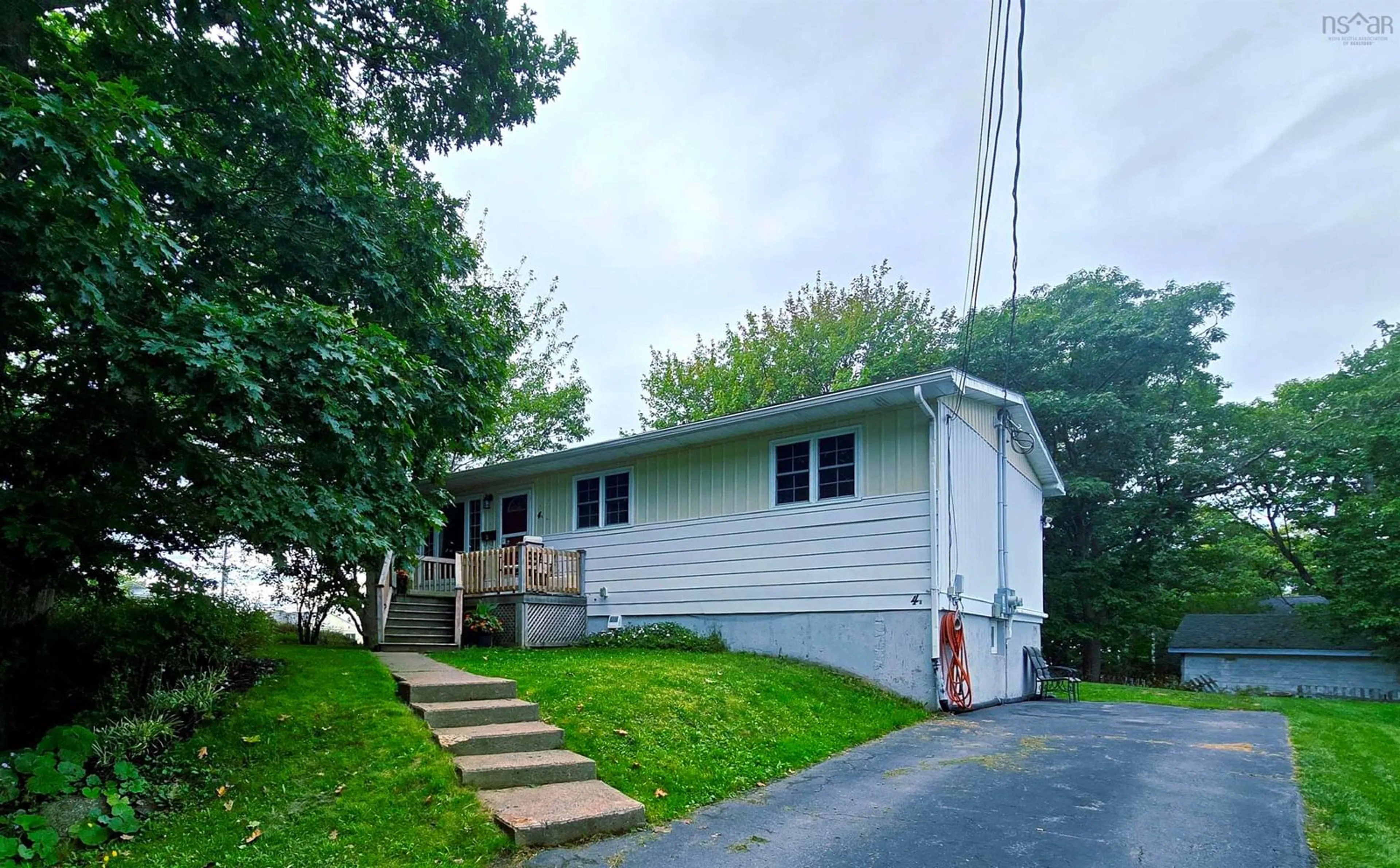 Home with vinyl exterior material, street for 4 Ida St, Spryfield Nova Scotia B3P 1W9