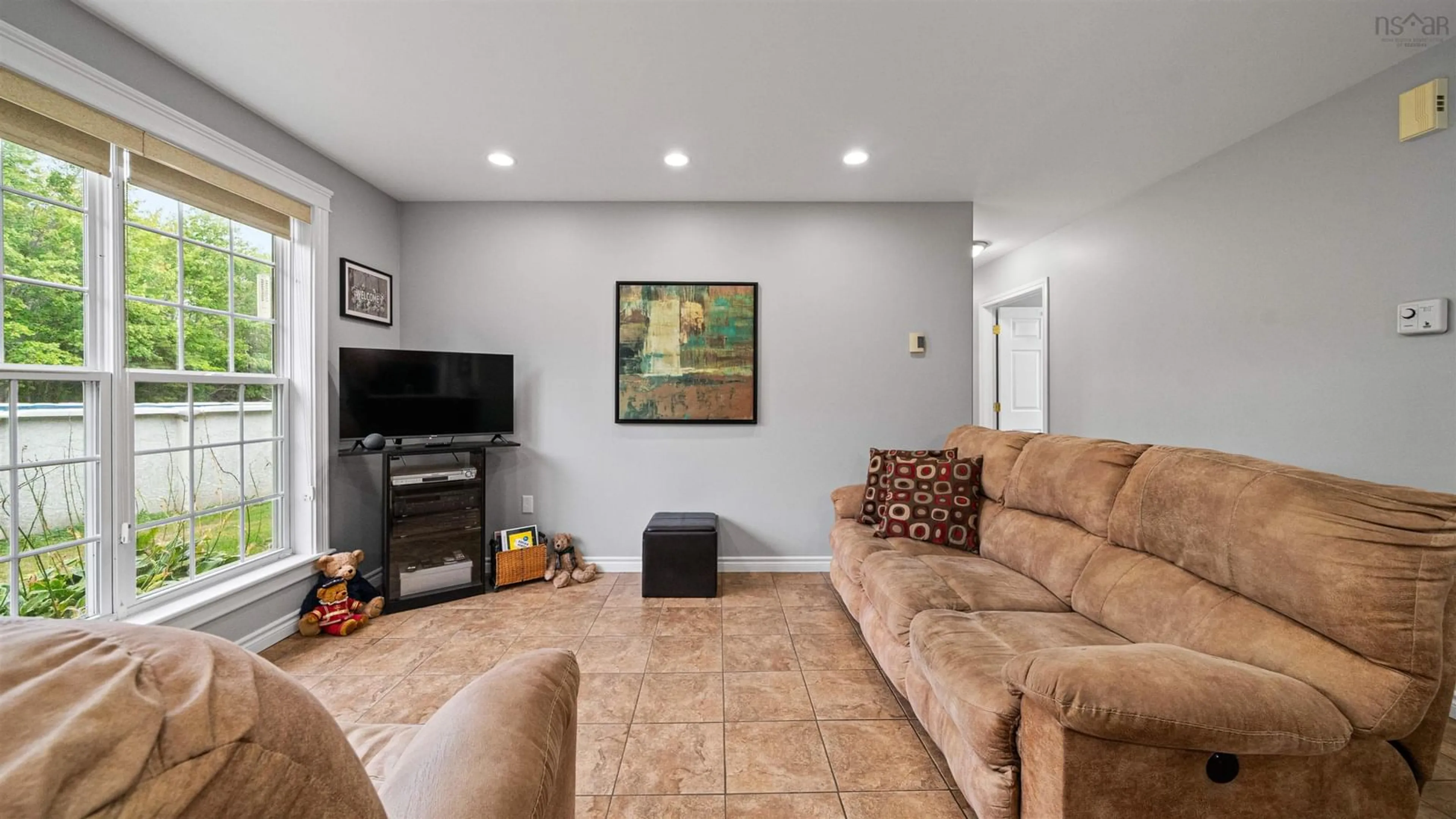 Living room with furniture, ceramic/tile floor for 3227 Highway 4, Central West River Nova Scotia B0K 1P0