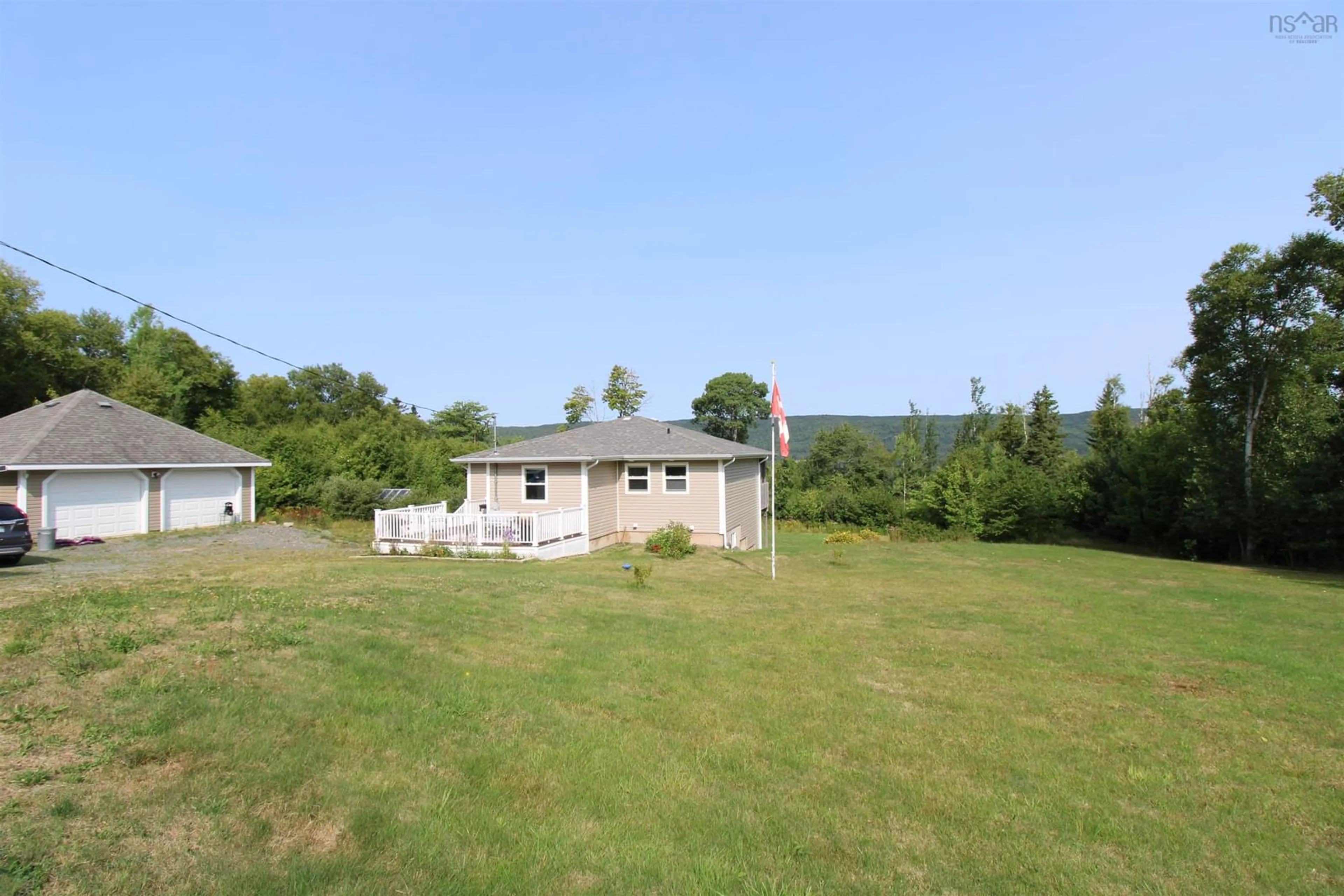 A pic from outside/outdoor area/front of a property/back of a property/a pic from drone, mountain view for 11599 Kempt Head Rd, Boularderie Center Nova Scotia B1X 1K6