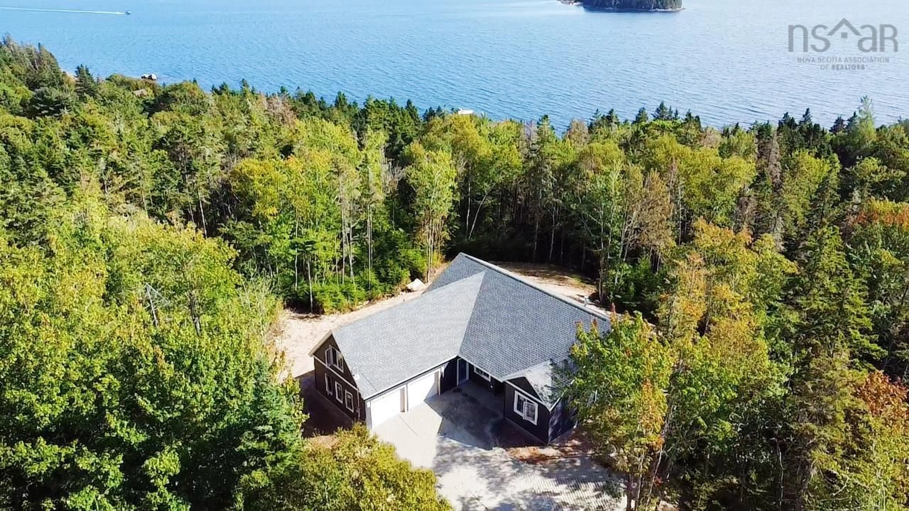 A pic from outside/outdoor area/front of a property/back of a property/a pic from drone, water/lake/river/ocean view for 85 Hillside Dr, Boutiliers Point Nova Scotia B3Z 1W9