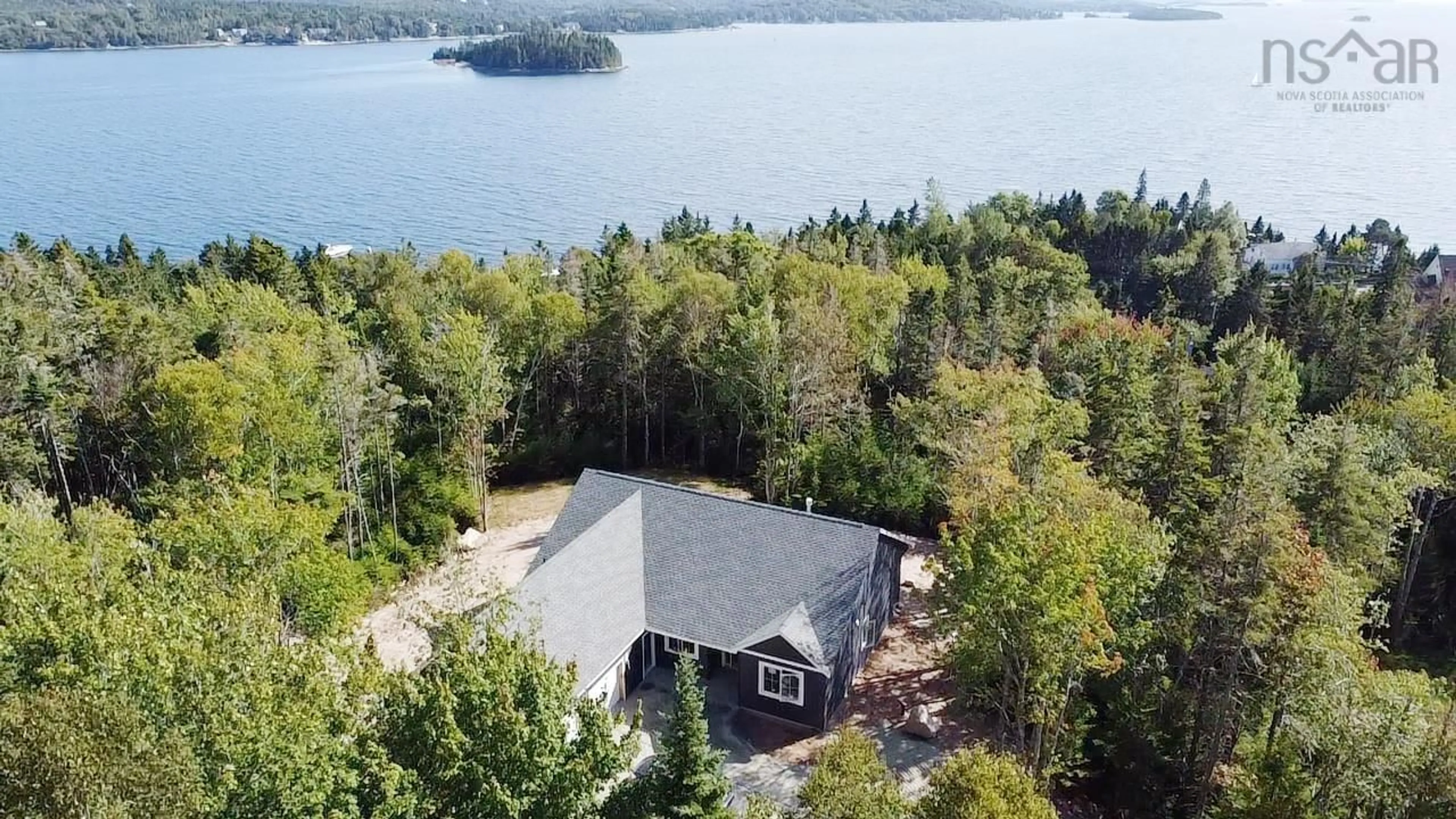 A pic from outside/outdoor area/front of a property/back of a property/a pic from drone, water/lake/river/ocean view for 85 Hillside Dr, Boutiliers Point Nova Scotia B3Z 1W9
