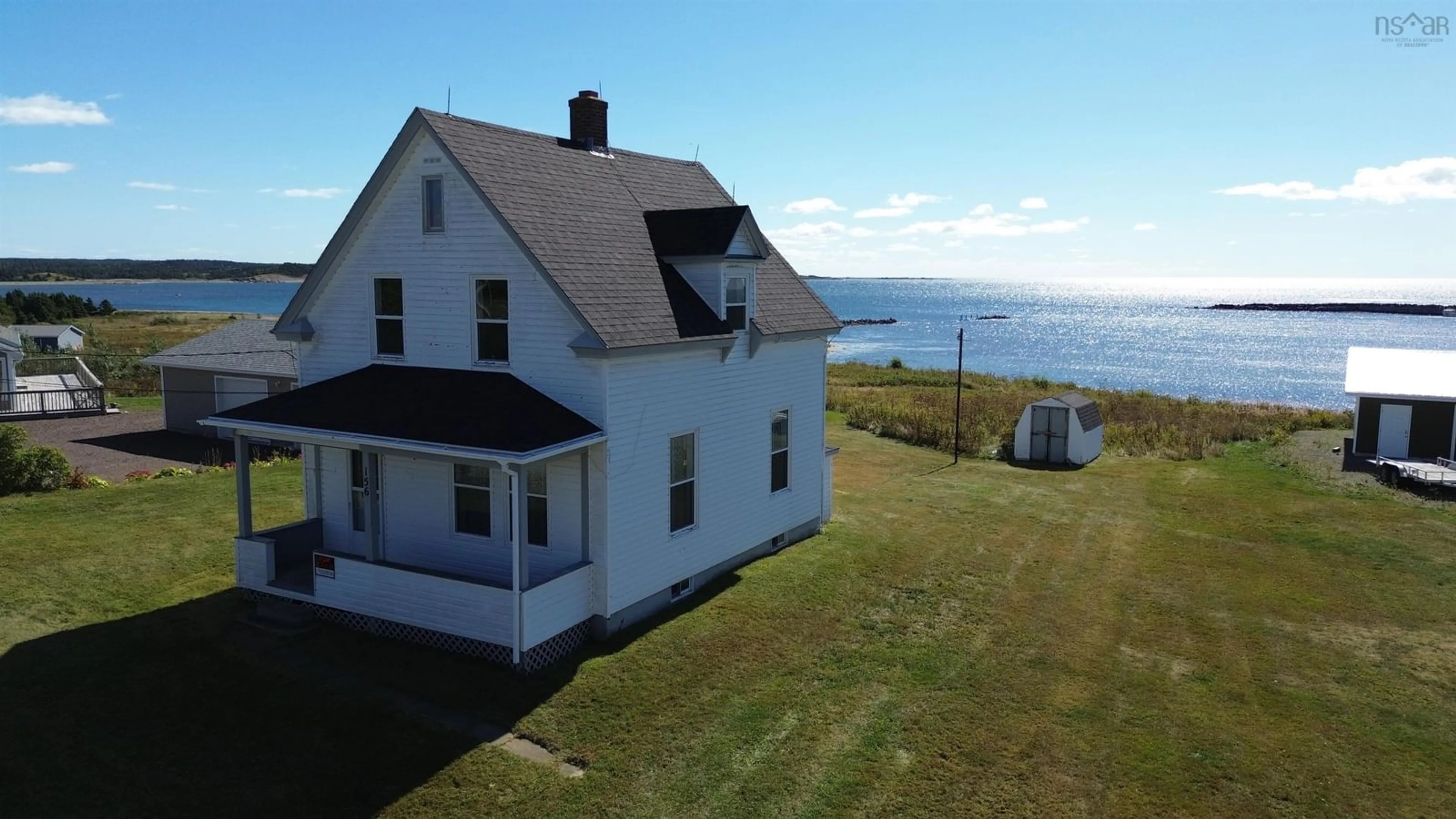 A pic from outside/outdoor area/front of a property/back of a property/a pic from drone, water/lake/river/ocean view for 156 Chapel Cove Rd, L'Ardoise Nova Scotia B0E 1S0