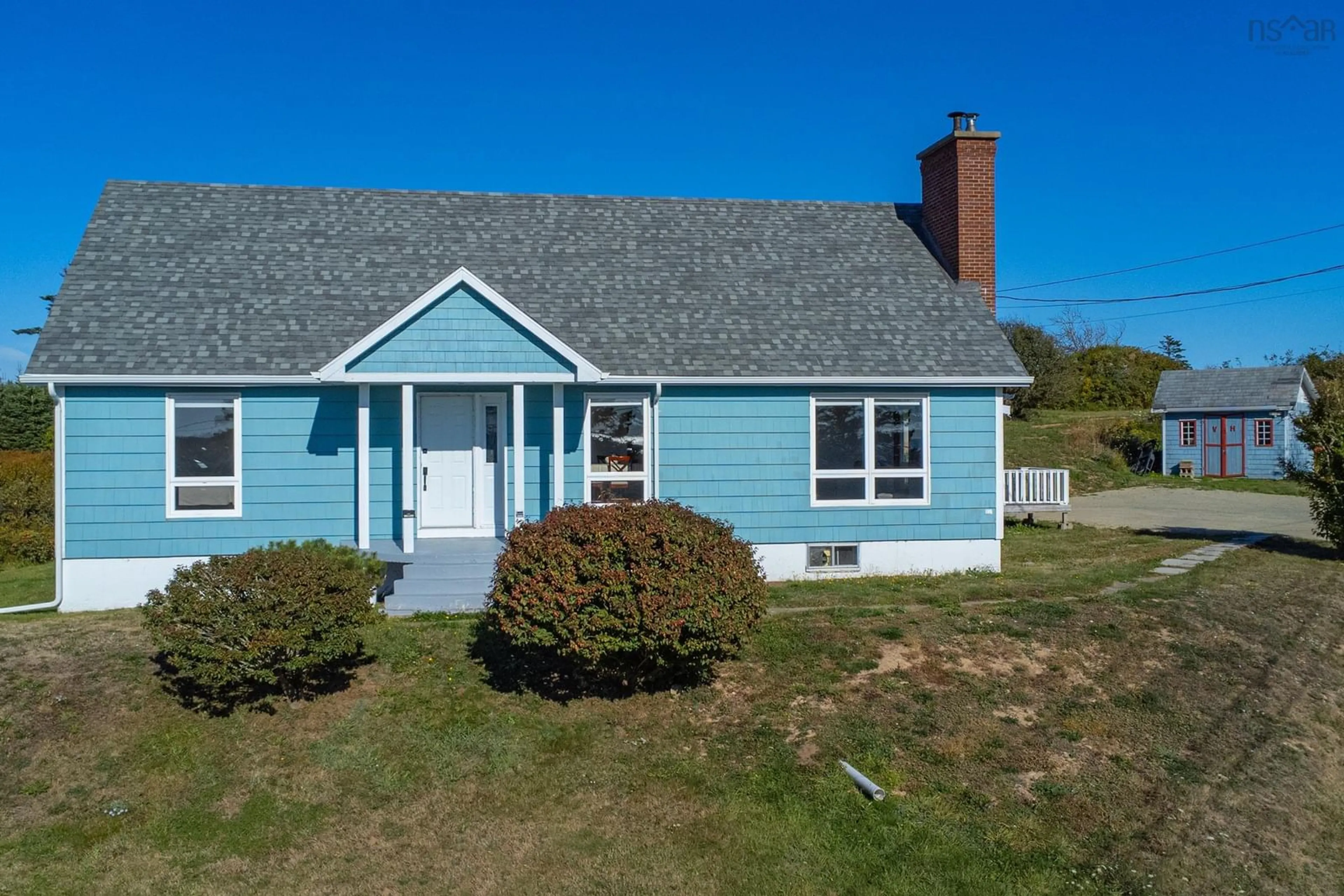 Home with vinyl exterior material, street for 5956 Highway 1, Mavillette Nova Scotia B5A 5B3