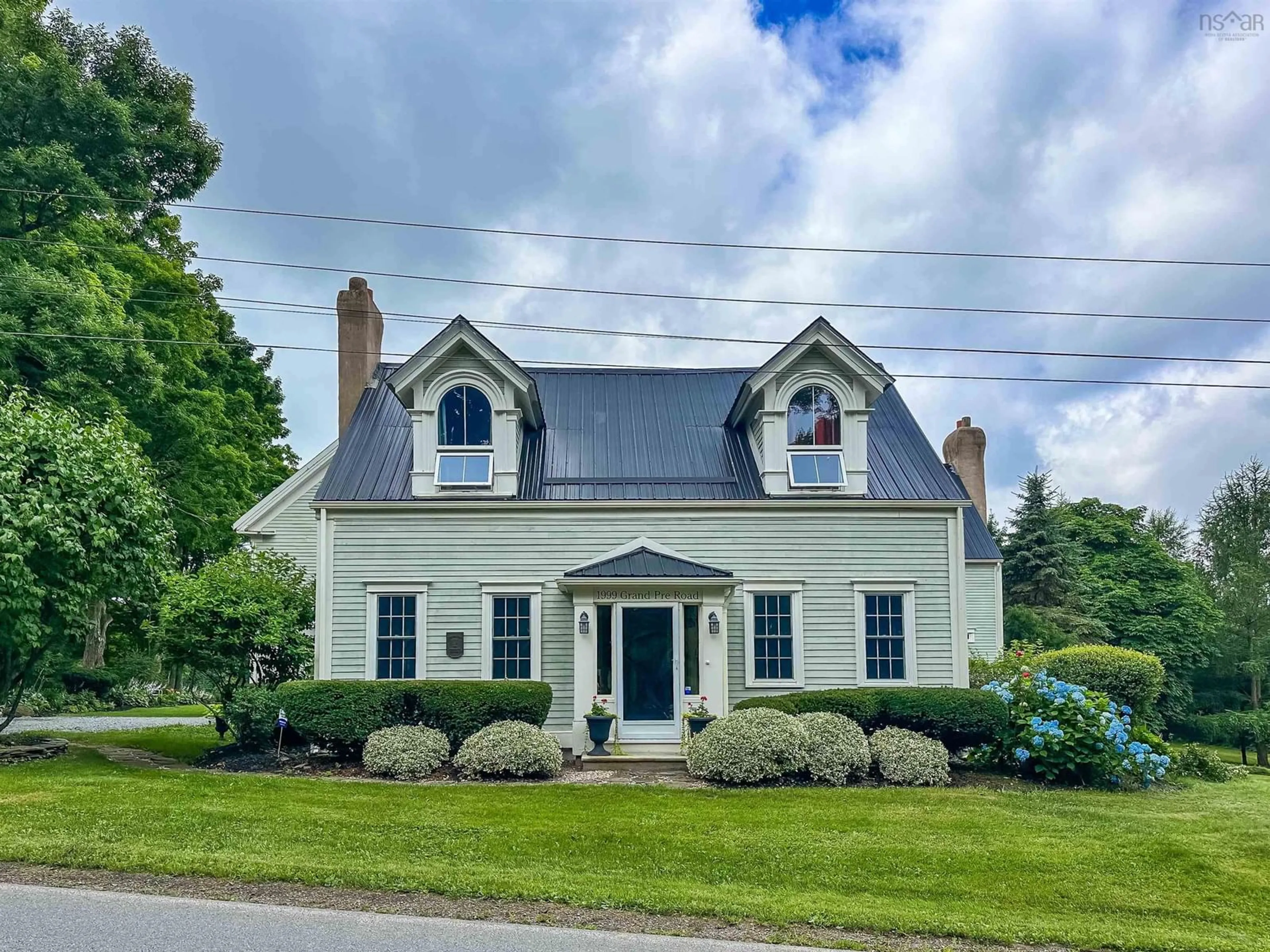 Home with vinyl exterior material, street for 1999 Grand Pre Rd, Grand Pré Nova Scotia B0P 1M0