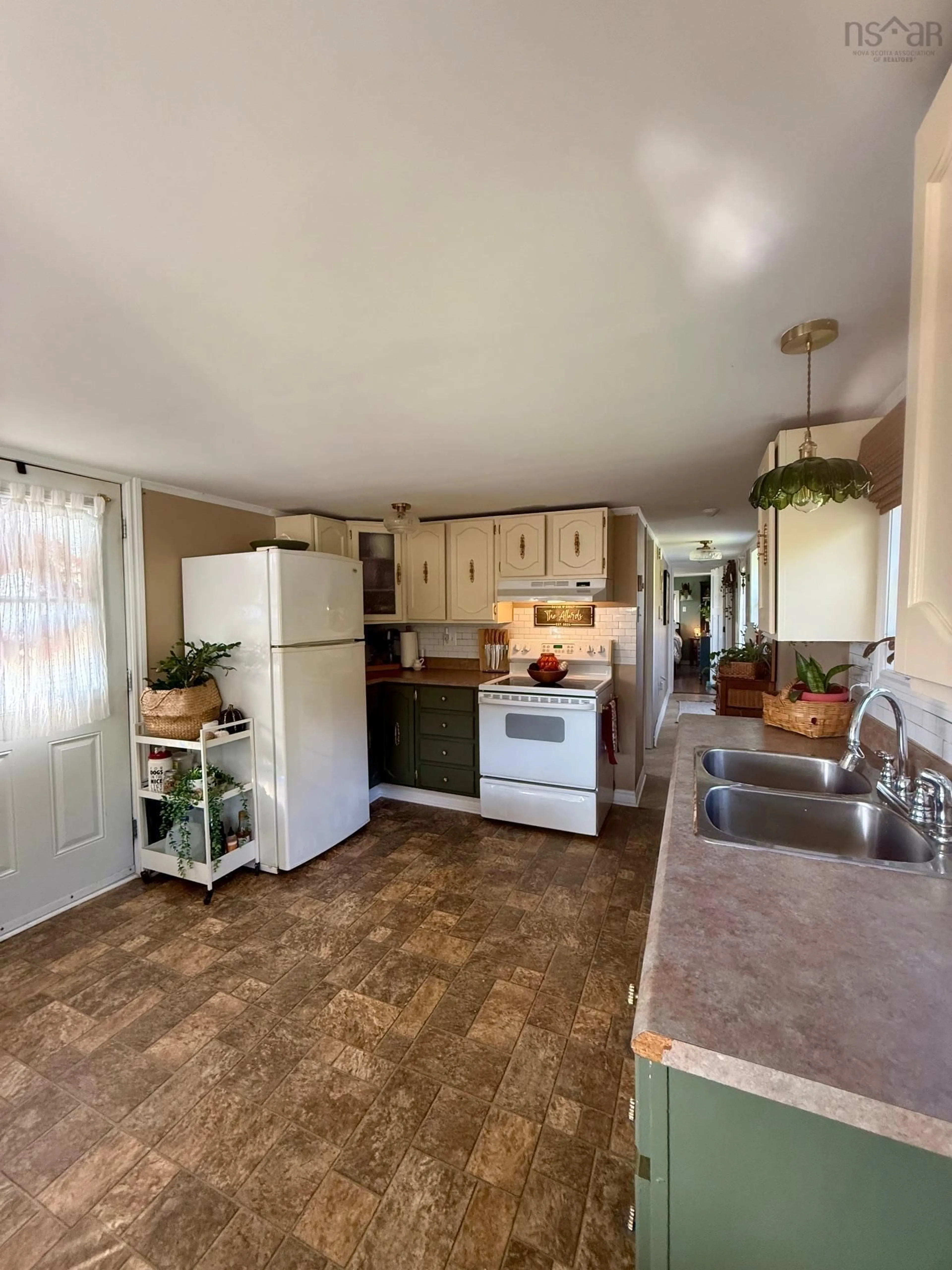 Open concept kitchen, ceramic/tile floor for 115 Marsh Road, Coalburn Nova Scotia B2H 5C7