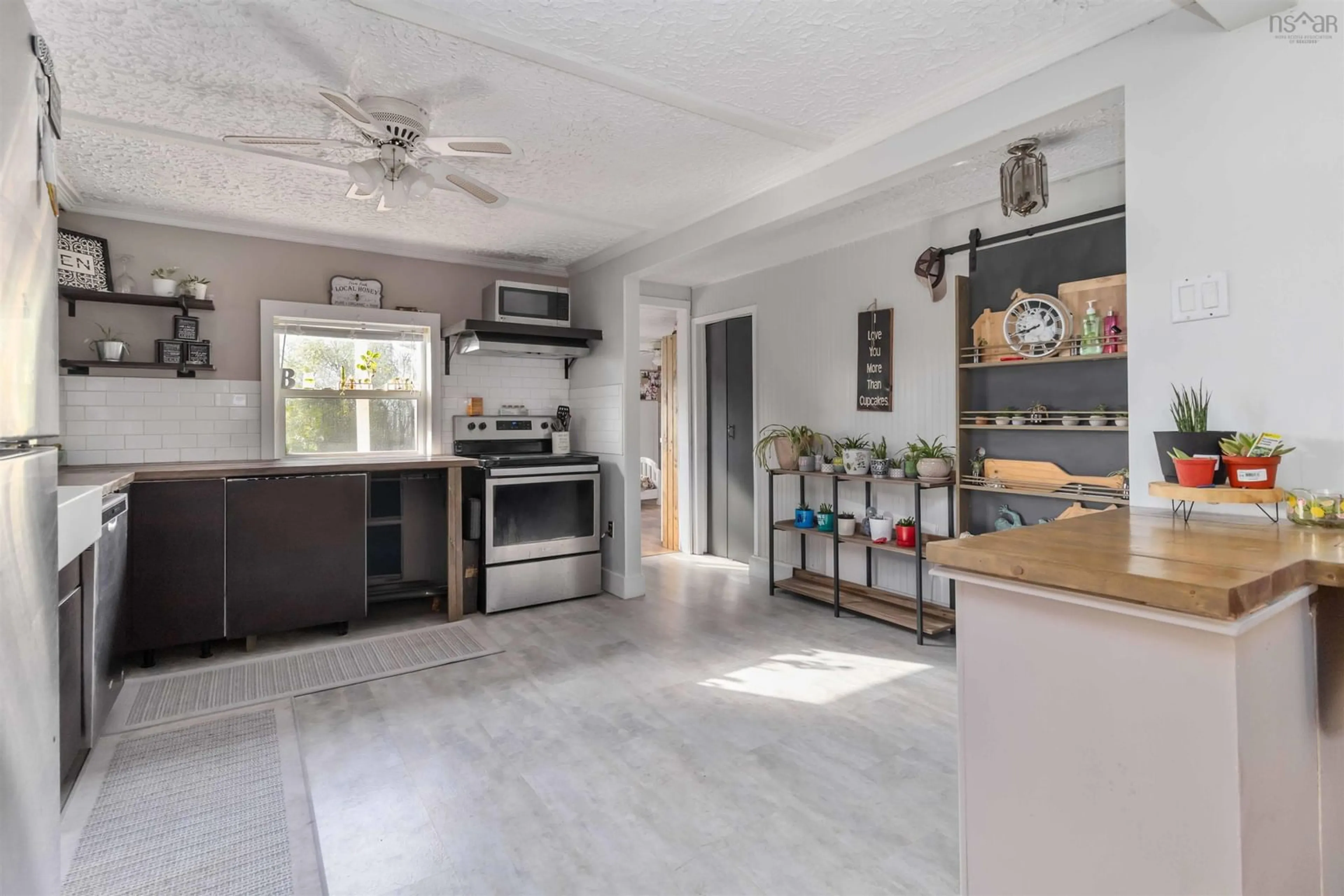 Open concept kitchen, ceramic/tile floor for 21 Littles Rd, Terence Bay Nova Scotia B3T 1Y7